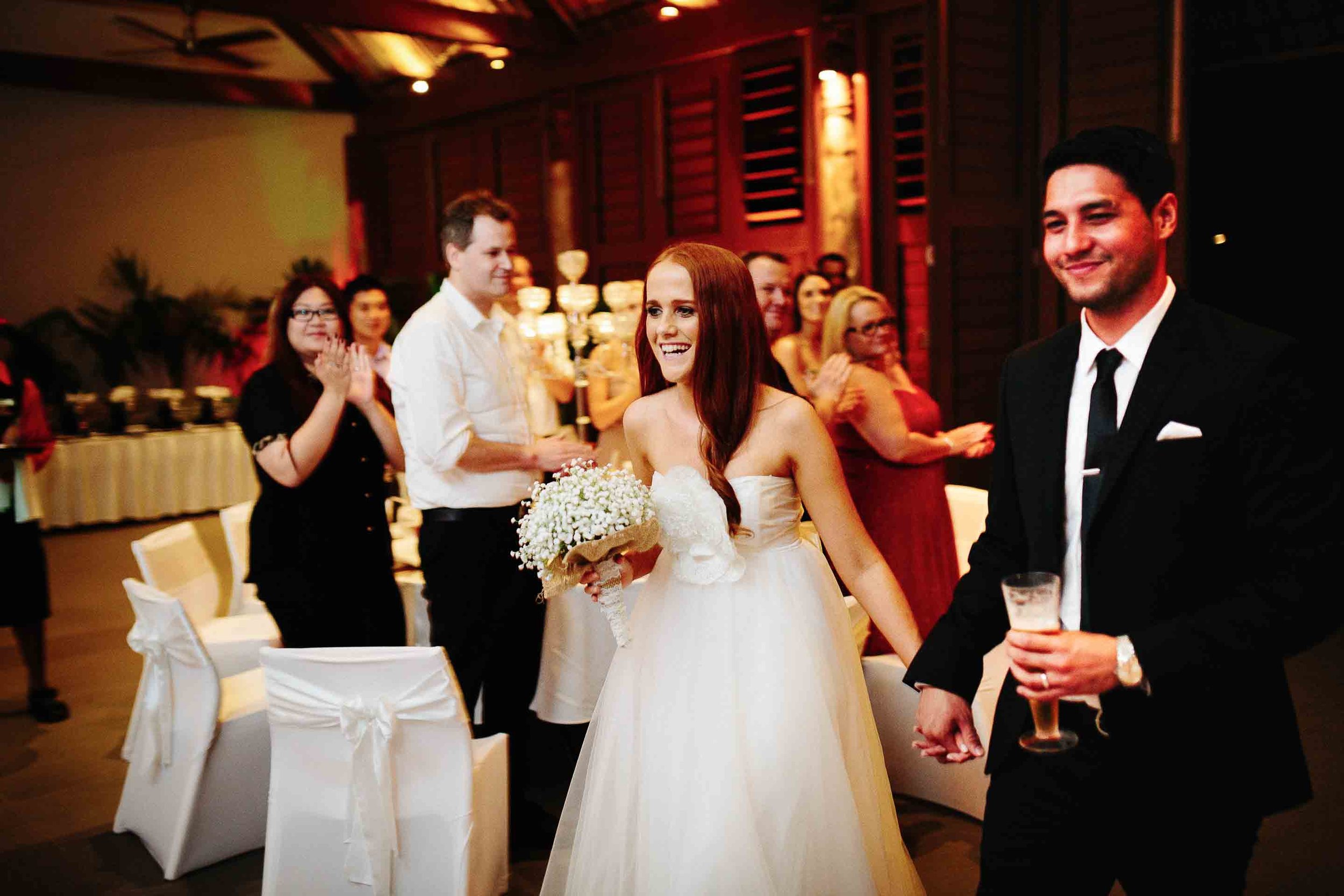 the bride and groom arriving at their reception dinner