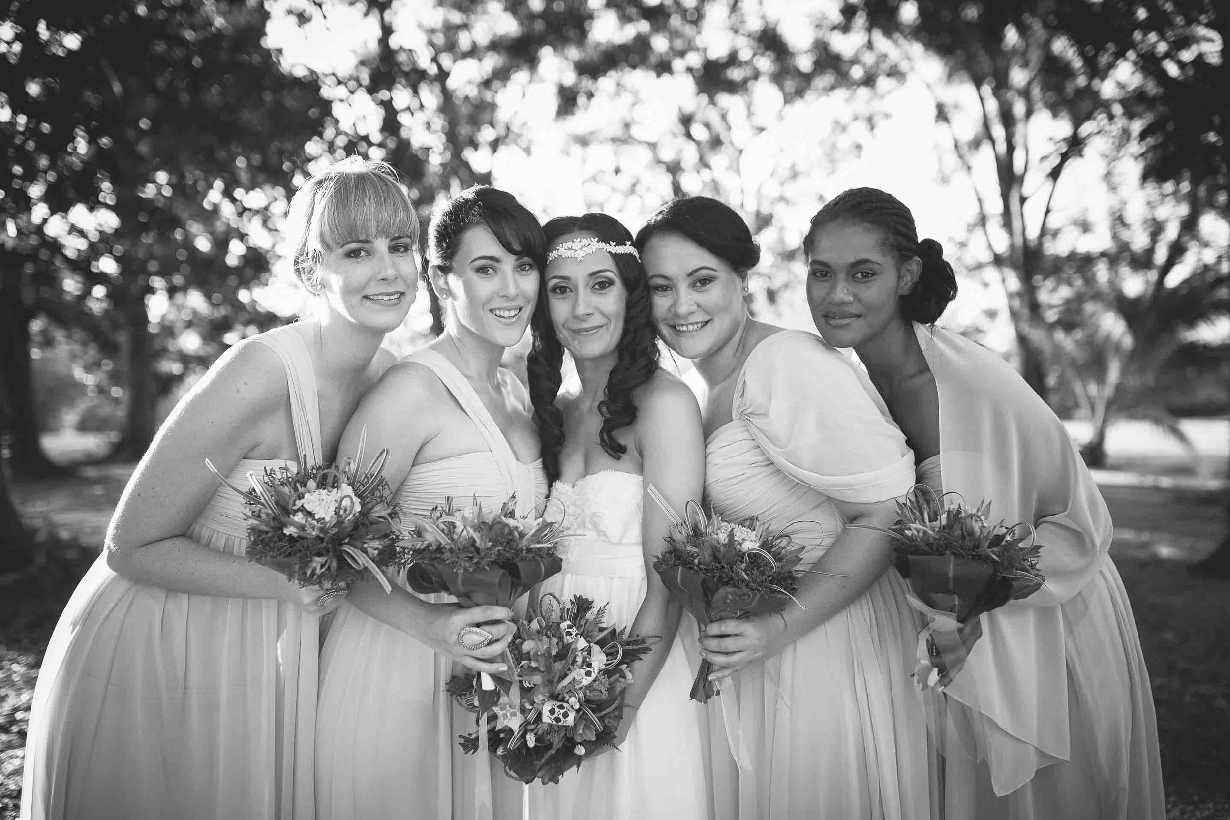 bridesmaids having a photo with the bride