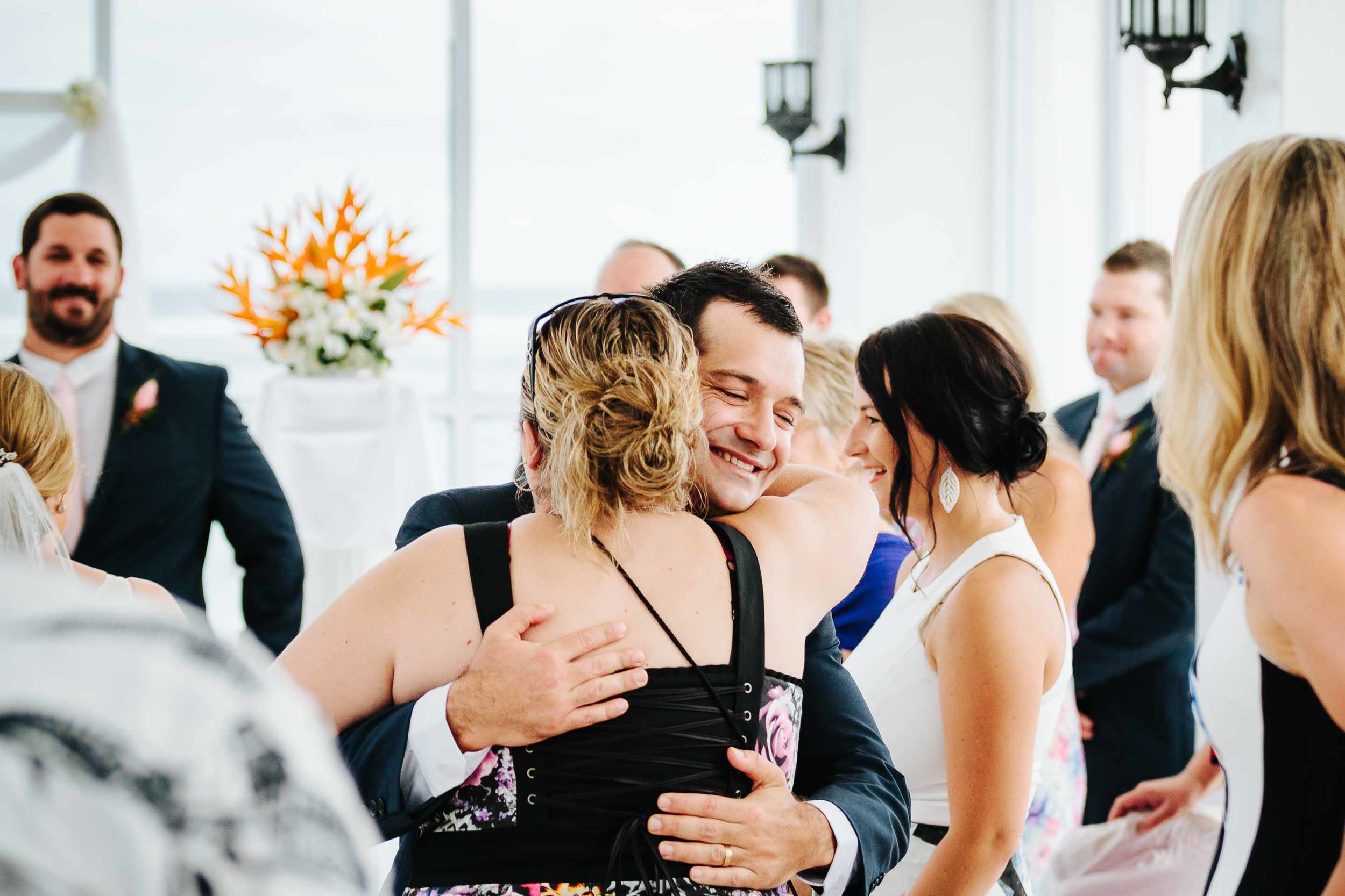 guests congratulating the groom