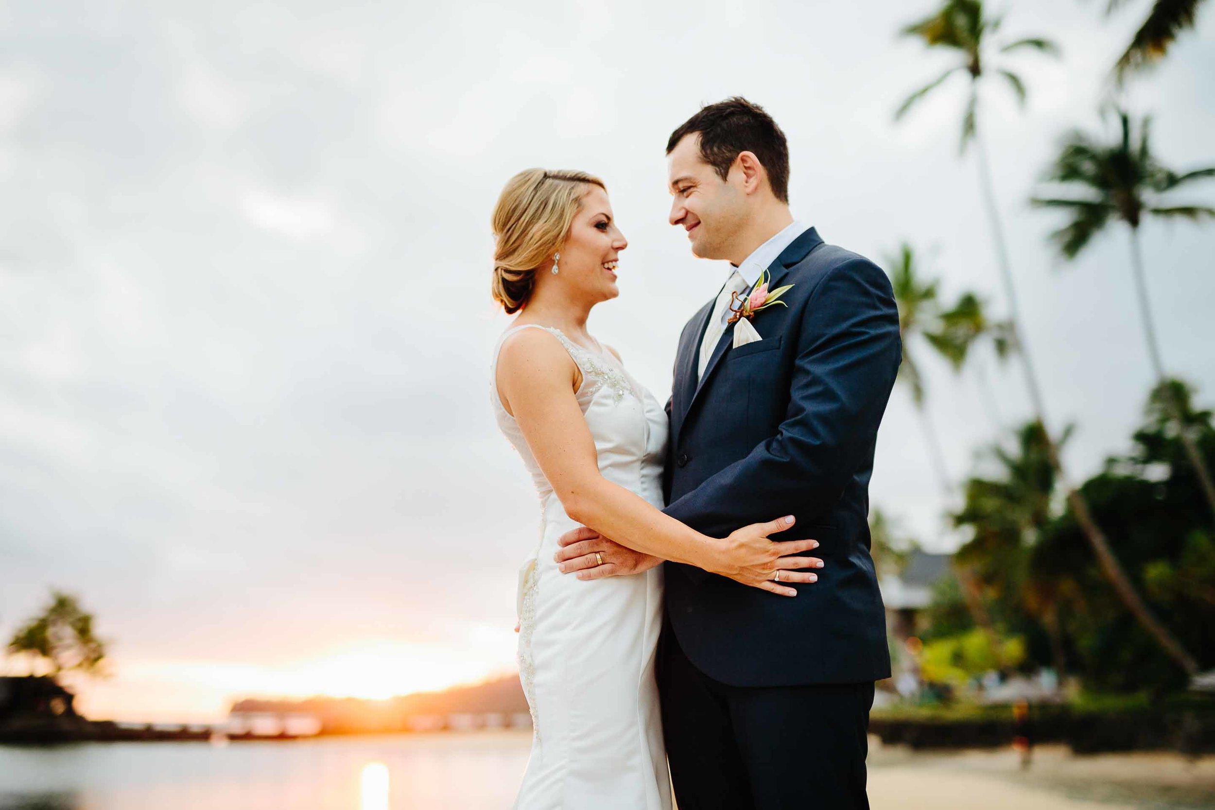 couple with stunning sunset behind them