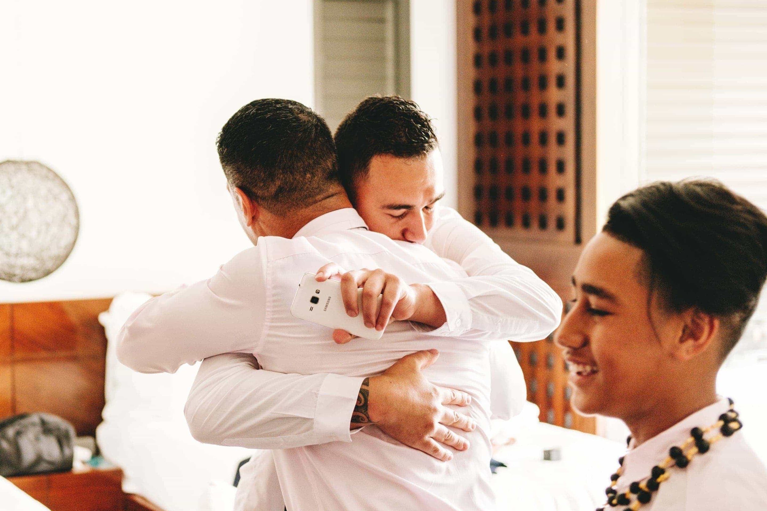 the groom embracing his father