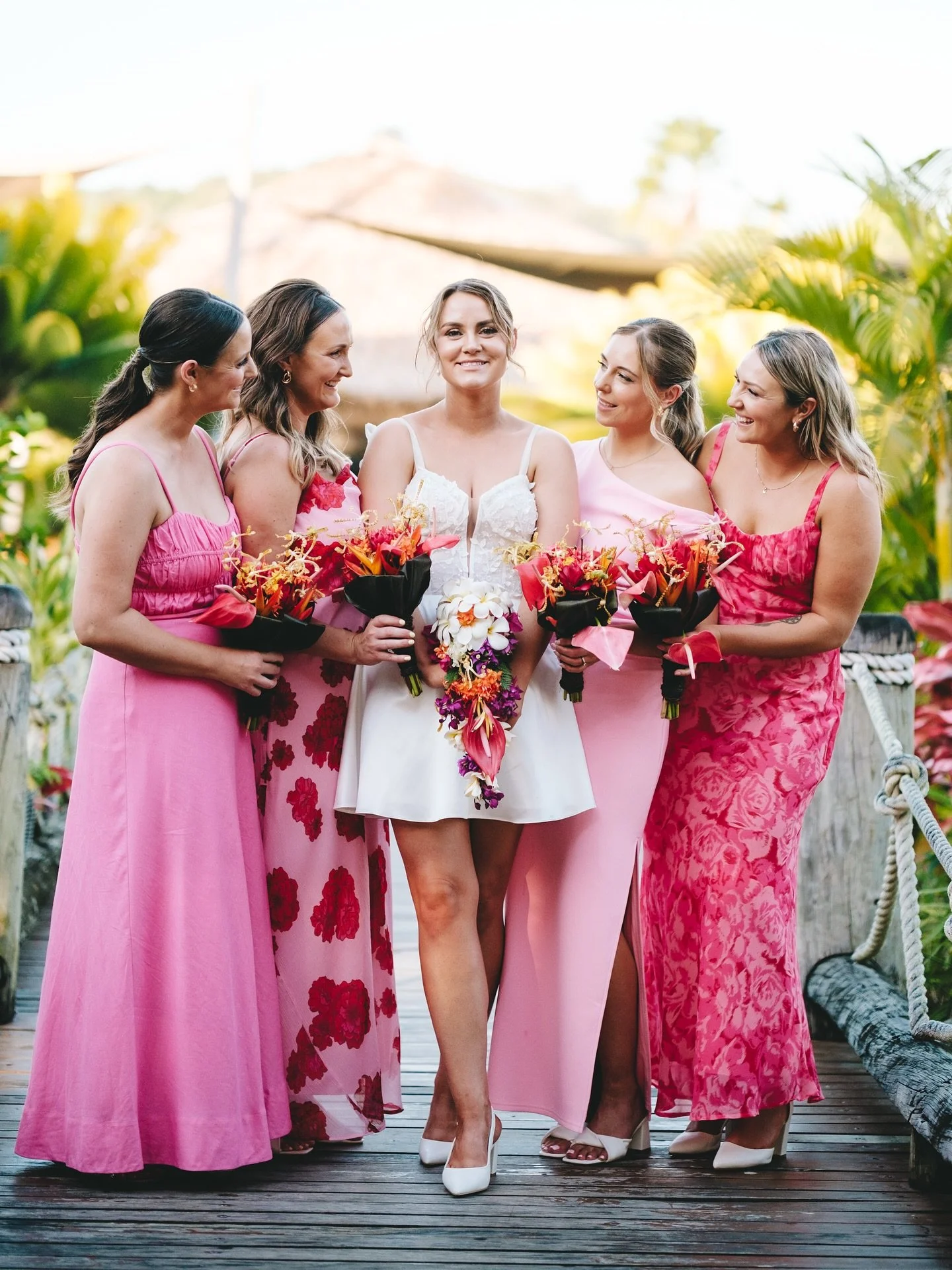 CHLOE &amp; STEVE 🩷 we love the pink palette with varying patterns and styles incorporated into the bridesmaids look, just perfect for an effortless tropical vibe and the brides dress skirt change was also a fun detail! Congratulations to the happy 
