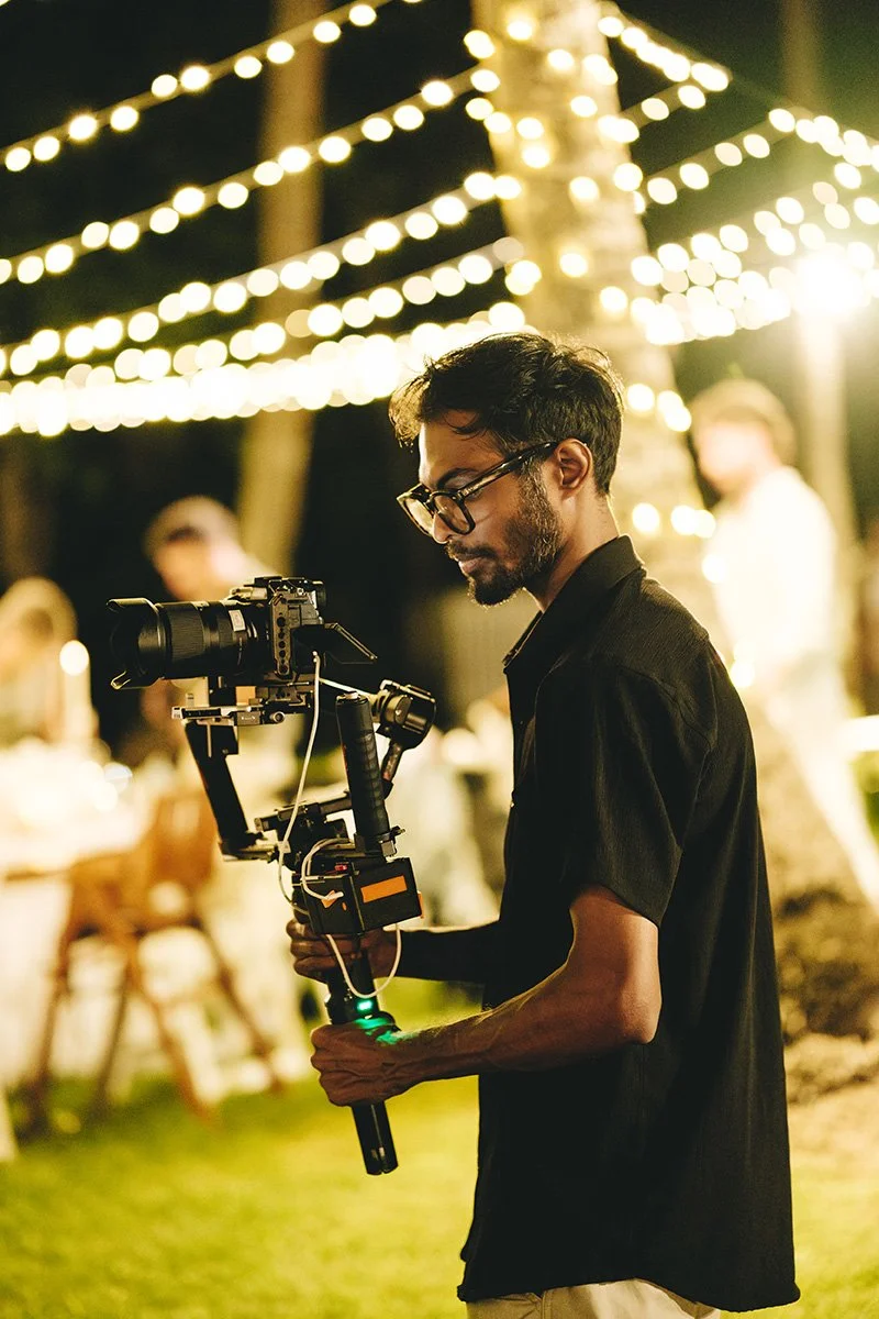 Senior Wedding Videographer Erol shooting a wedding with a Gimbal at a Chapel Lawn Reception hosted at the Shangri-La Yanuca Island