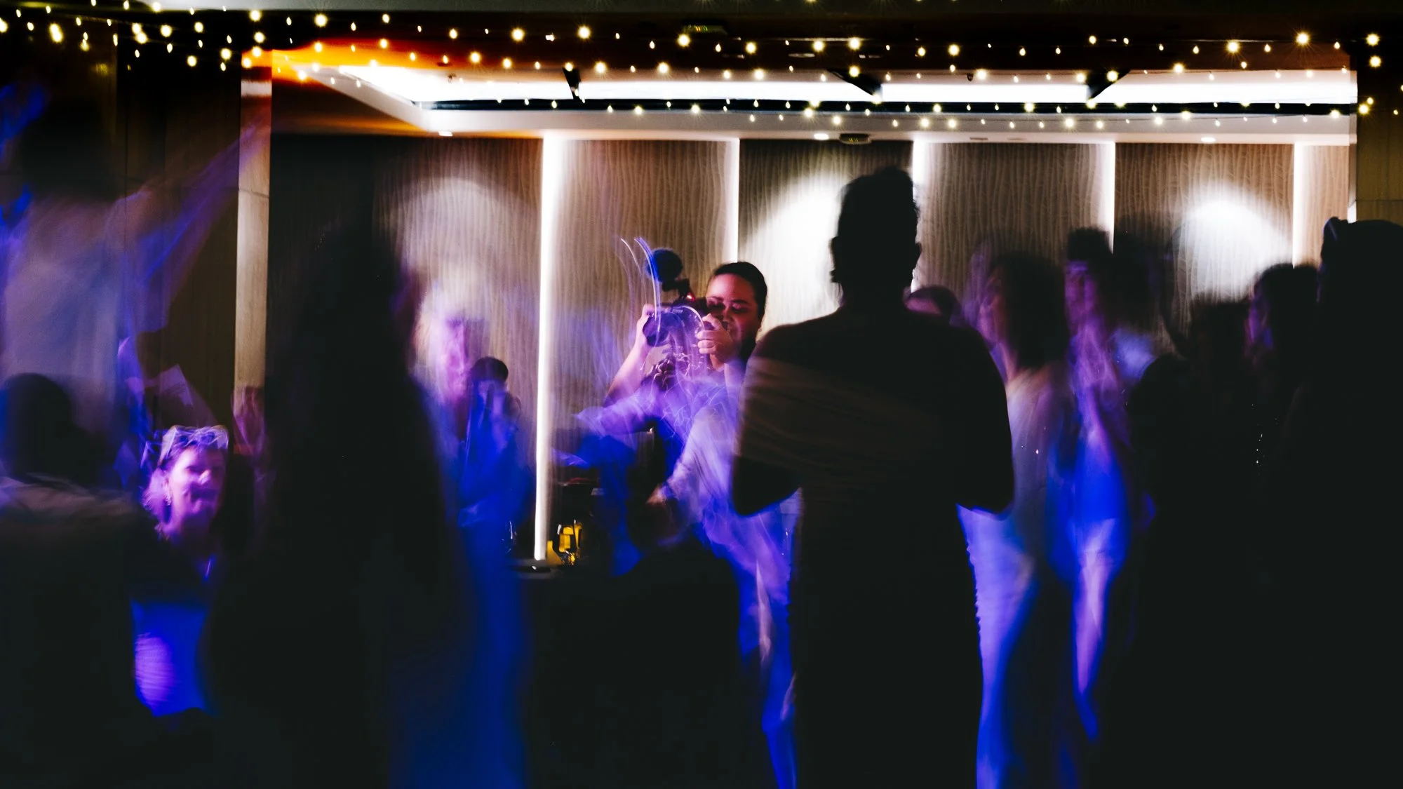 Lysa our videographer filming on the dancefloor at a recent wedding at the Sheraton Fiji