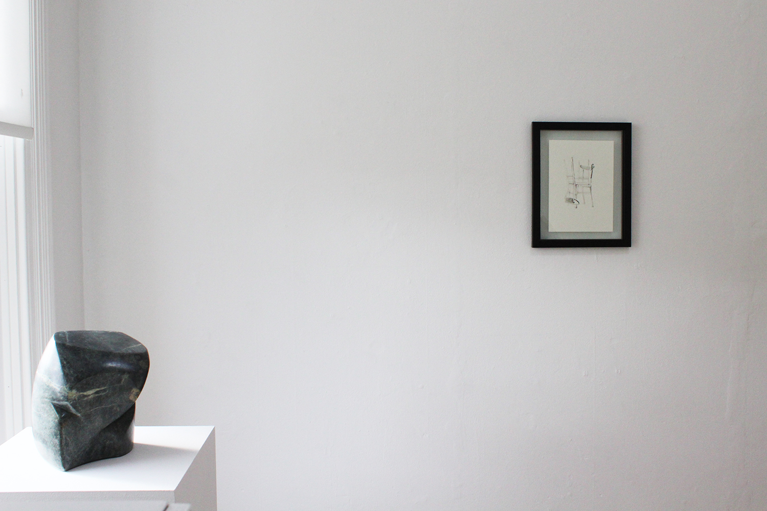 (L-R): Torso of a young boy and a hole to pick him up by, Soapstone, 23x21x15cm $850, Strange Coincidence, Ink on paper, 39x32x2cm $290