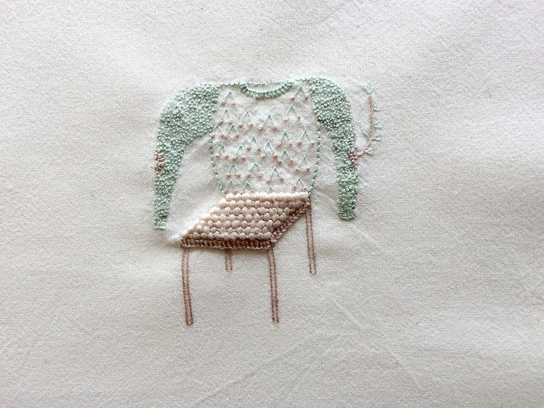 Chair with sweater with cherries.jpg