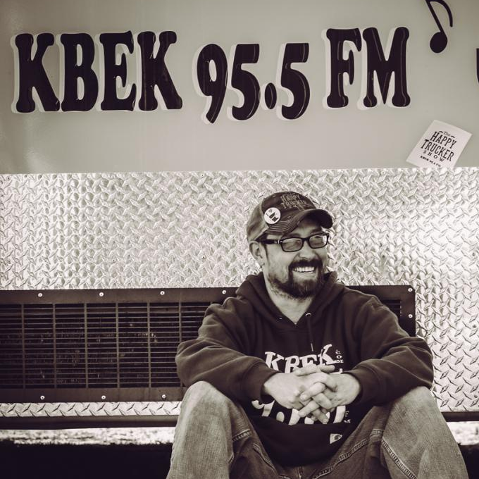 The Happy Trucker has been the voice of many local events, programs, concert series and The Happy Trucker Show on KBEK 95.5 FM, A live radio show that plays 'Songs That Don't Suck'.