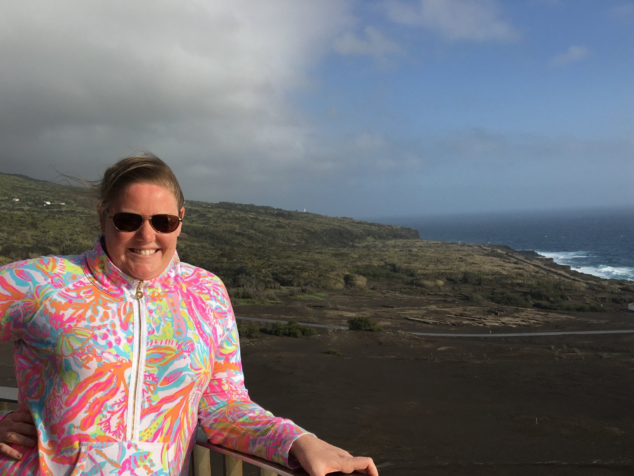 Sitting atop a buried lighthouse in Ponta dos Capelinhos, Faial Island, Azores, Portugal. This area was buried by a volcanic eruption in 1957-1958 which displaced over 2,000 Azorean people and buried this lighthouse.