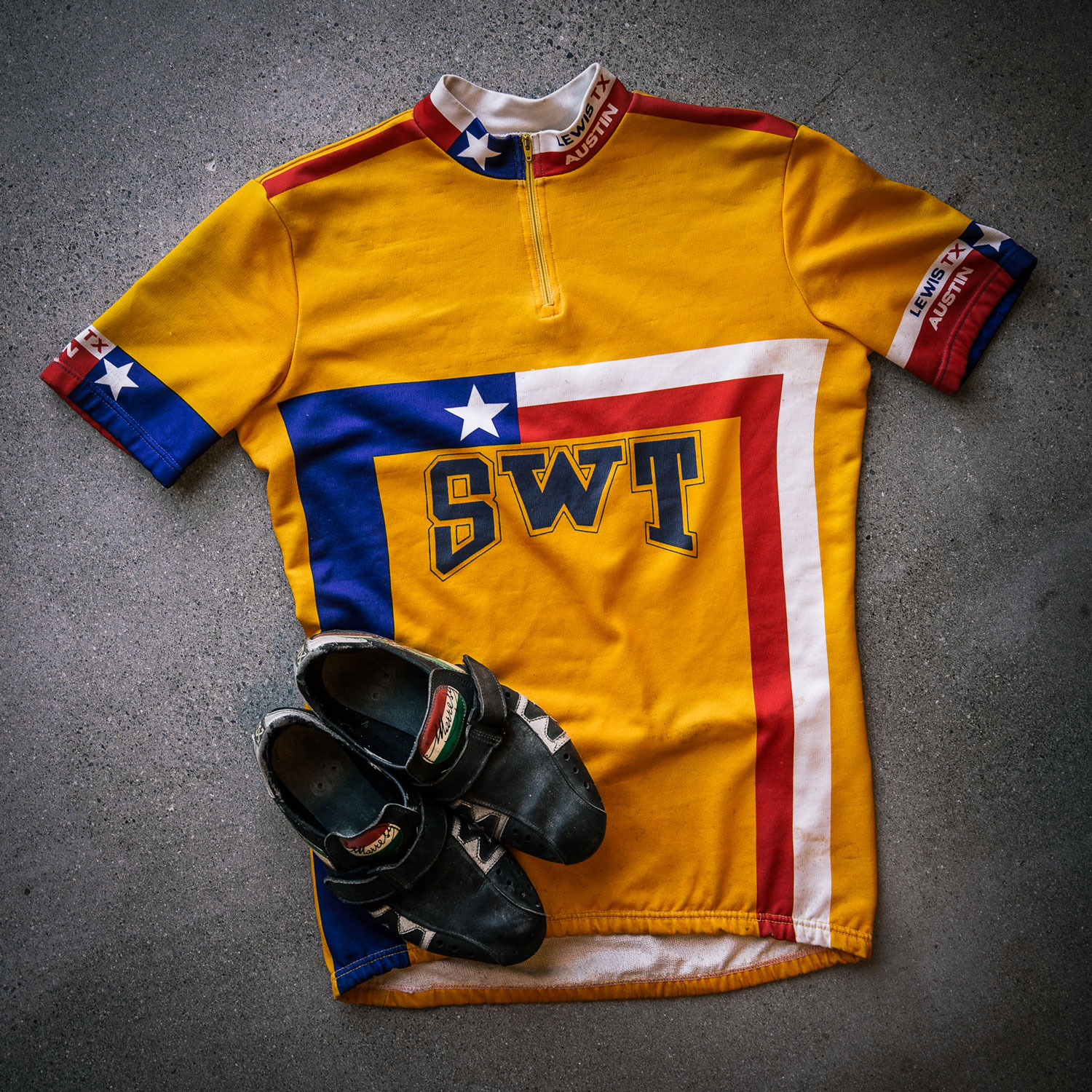Gluckman’s Southwest Texas State University team jersey and bike shoes. Photo by James Harnois.