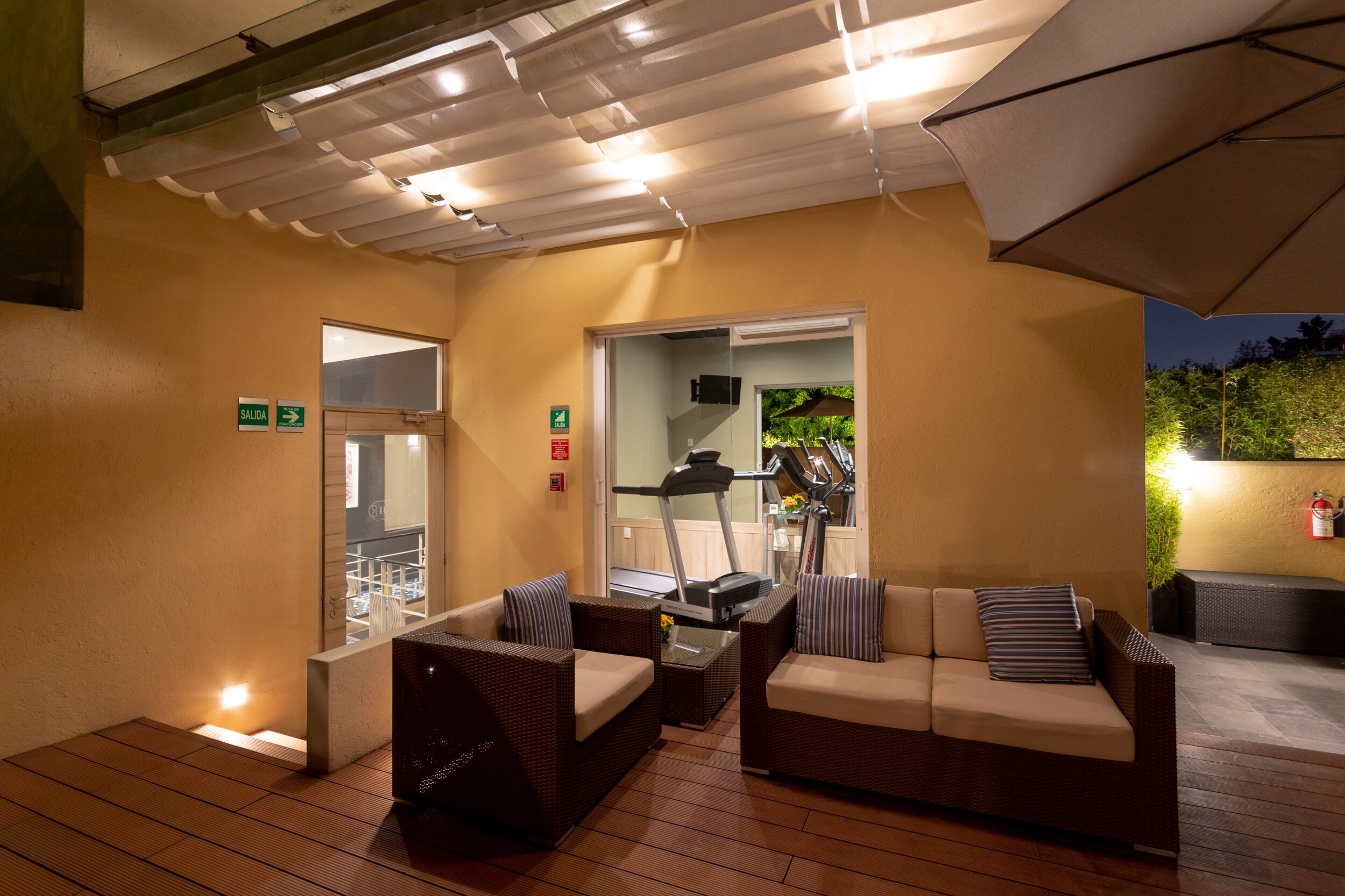 One Day in Mexico Microstay Casa Malí Terrace and Gym at Night.JPG