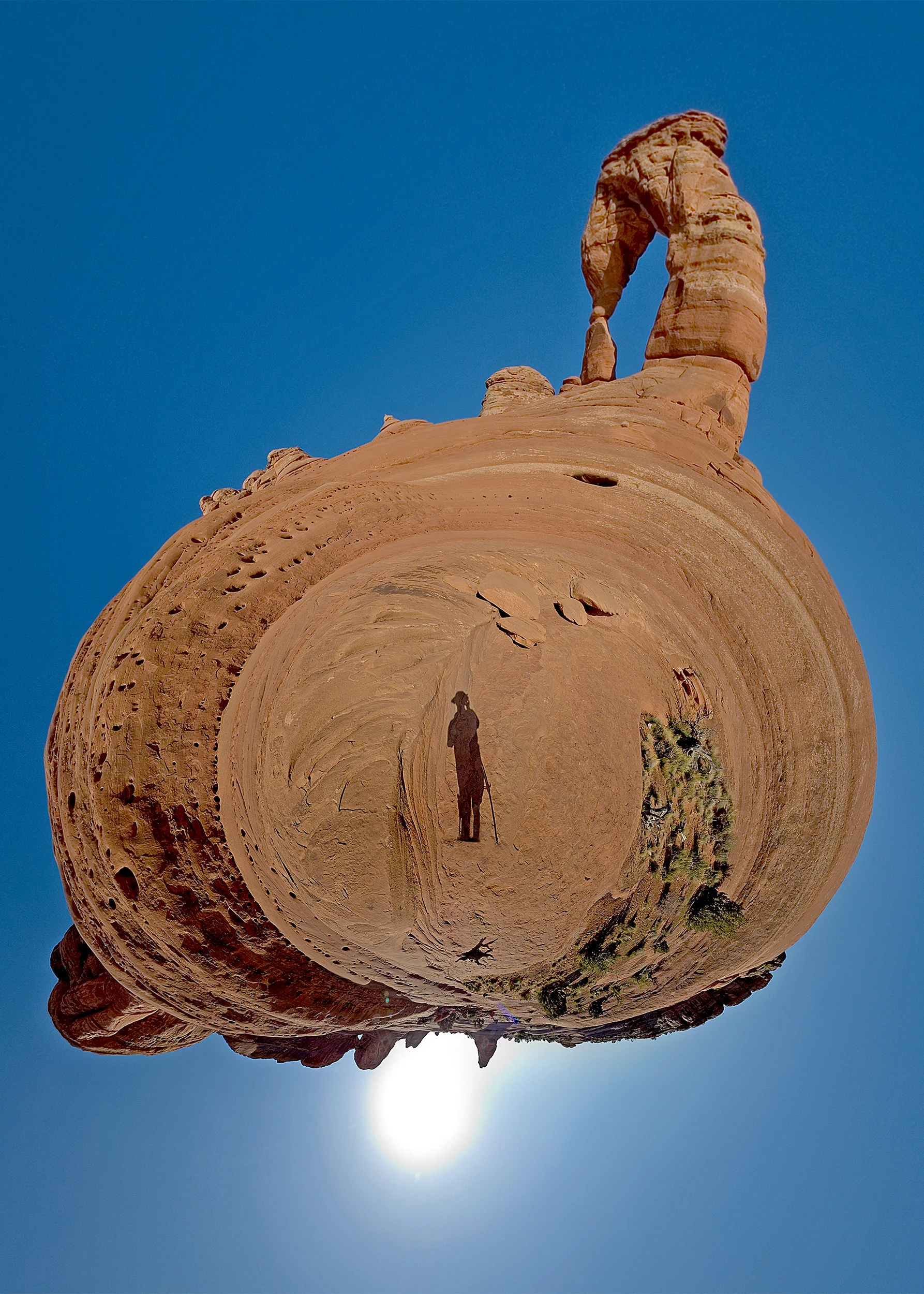 Self portrait “planet” panorama at Delicate Arch, Arches National Park. Dan Bailey, 2010