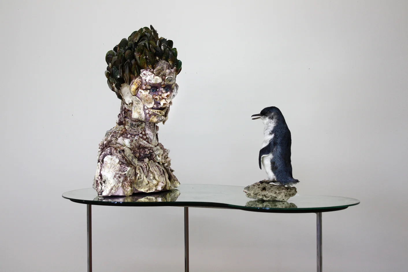  Waterspeaker 2011 Steel stand, mirror, taxidermied penguin, glass eyes, rock   