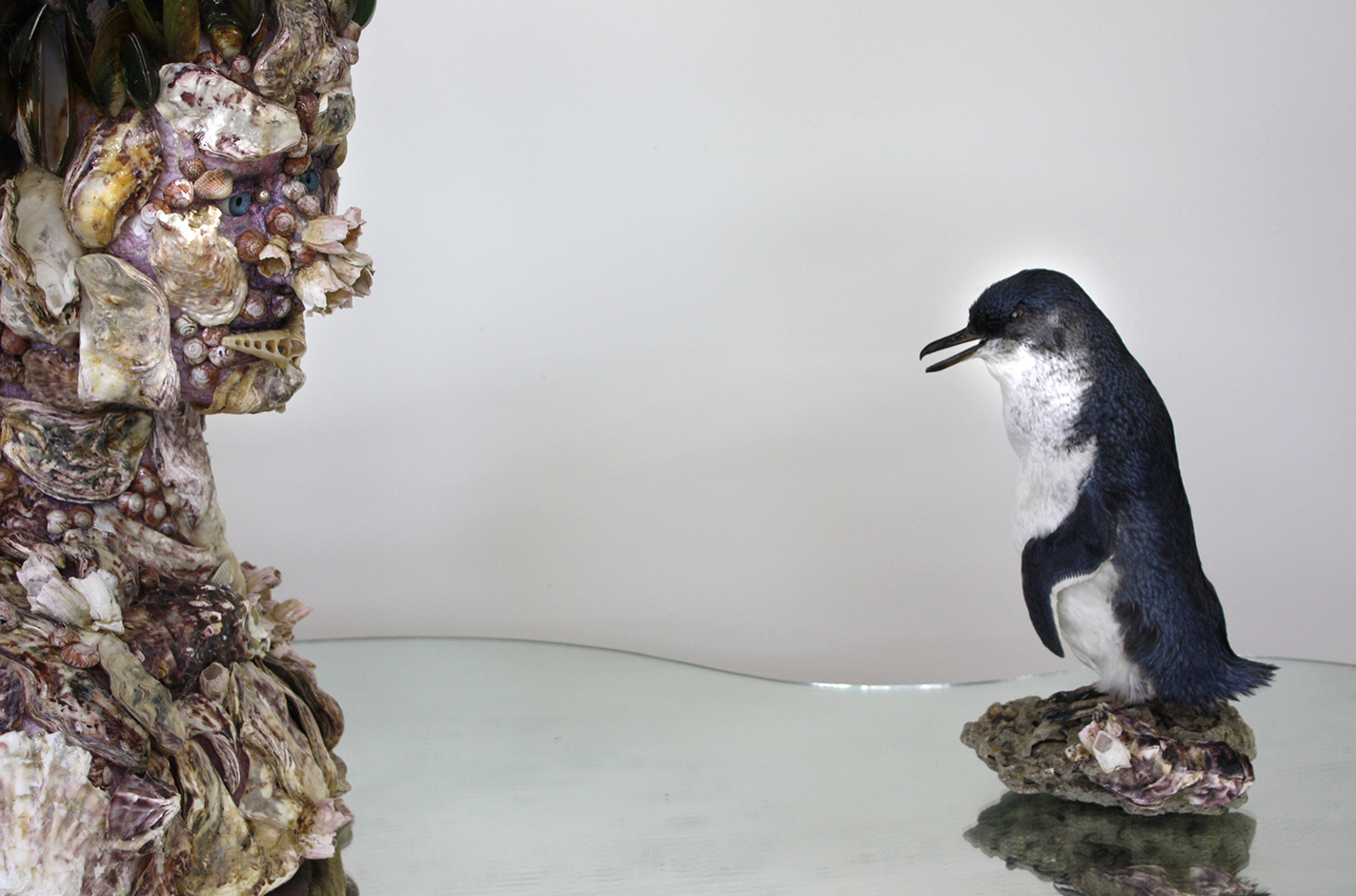  Waterspeaker 2011 Steel stand, mirror, taxidermied penguin, glass eyes, rock   