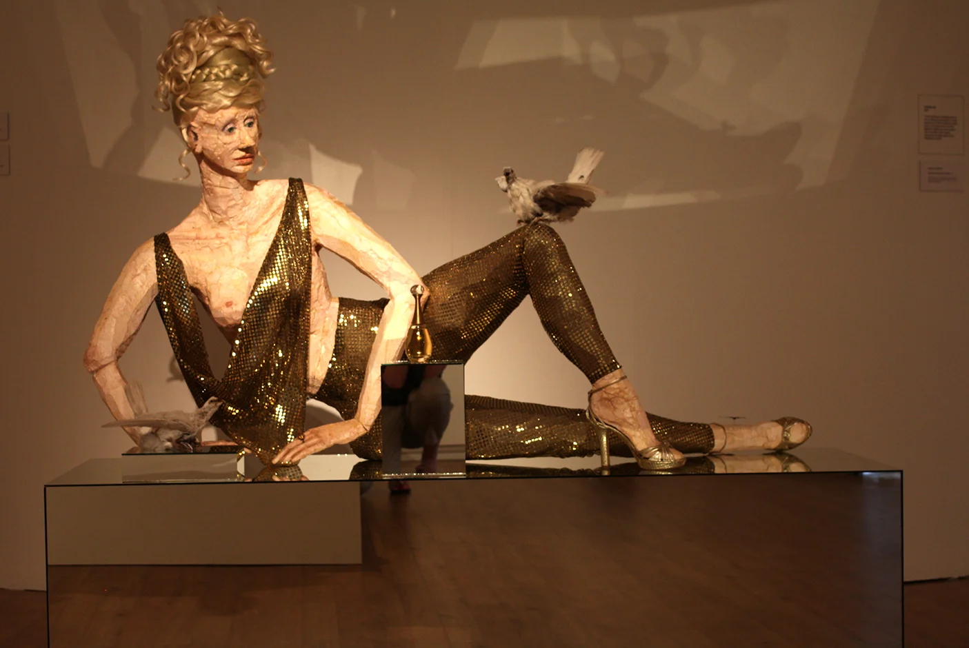 detail J'adore (with Snakeskin Heels) 2010 Armani snake-skin, high-heels, J'Adore perfume, polystyrene, wax, flocking, acrylic hair, pigeons, mirror, butterflies