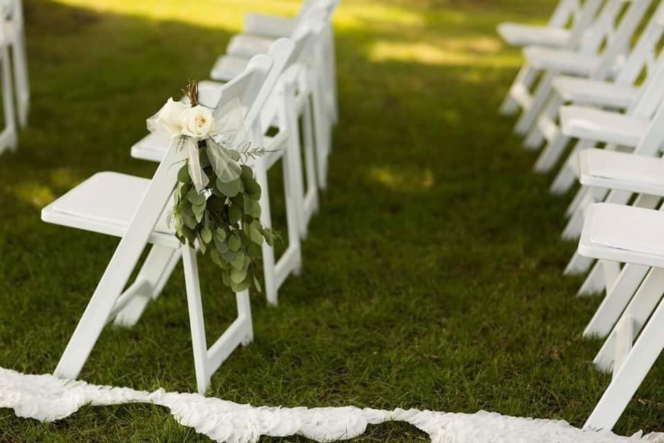wedding chairs on grass.jpg