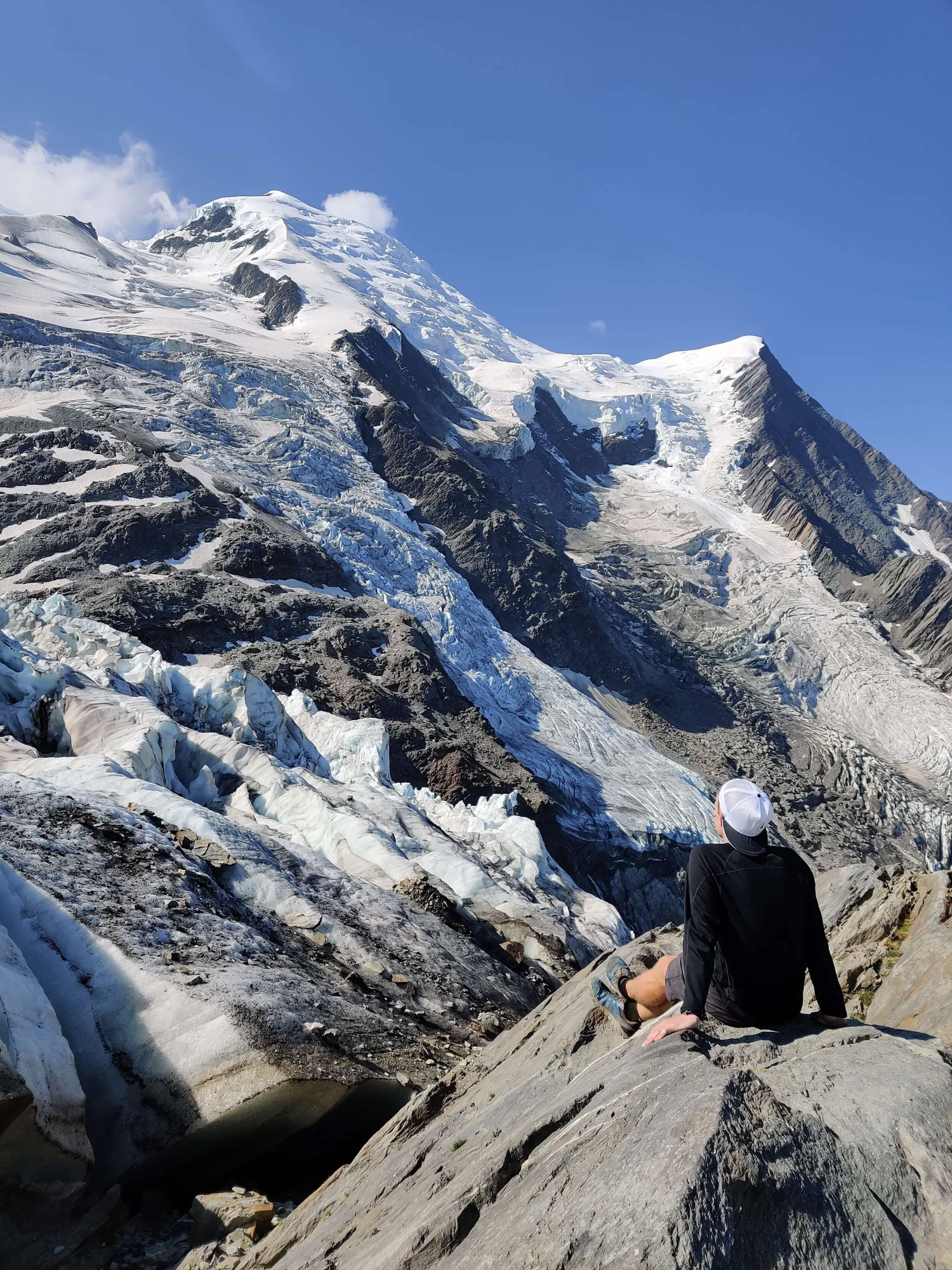 Hikers overlooking the mountains and glaciers above Chamonix
