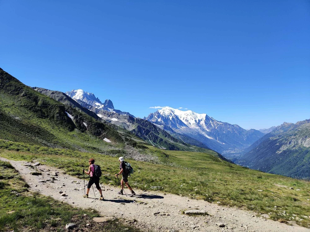 Hikers overlooking the Chamonix Valley and Mont Blanc