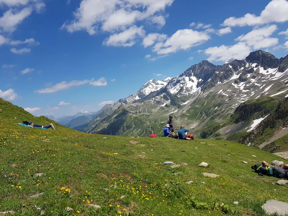 Hikers taking a break while hiking the Tour du Mont Blanc