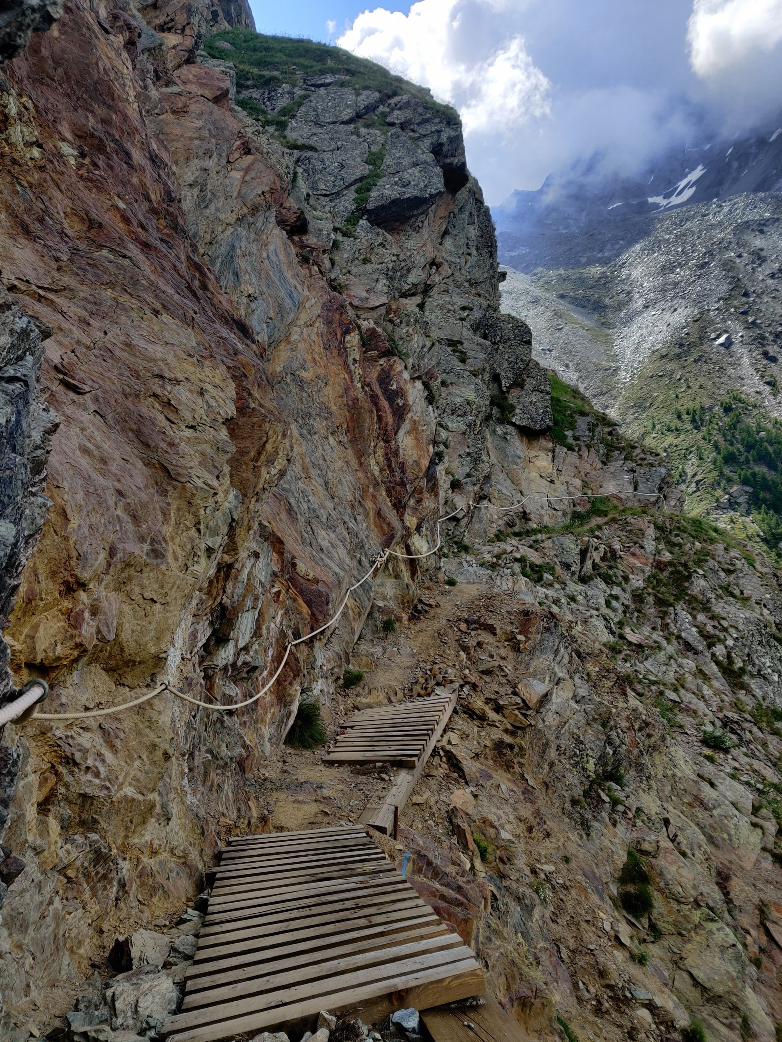 Narrow balcony trail with cable assistance