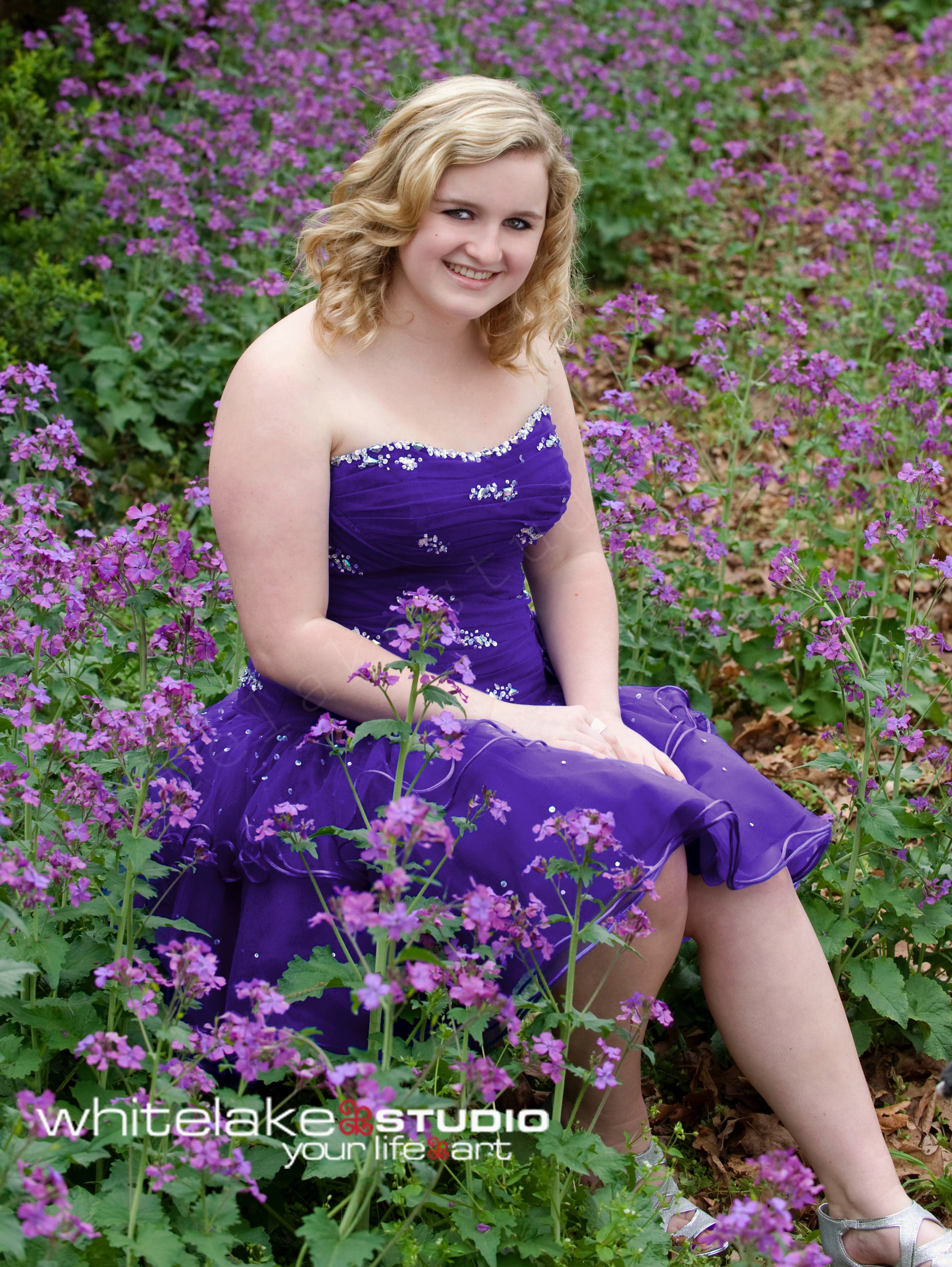 Formal senior portraits girl in purple flowers