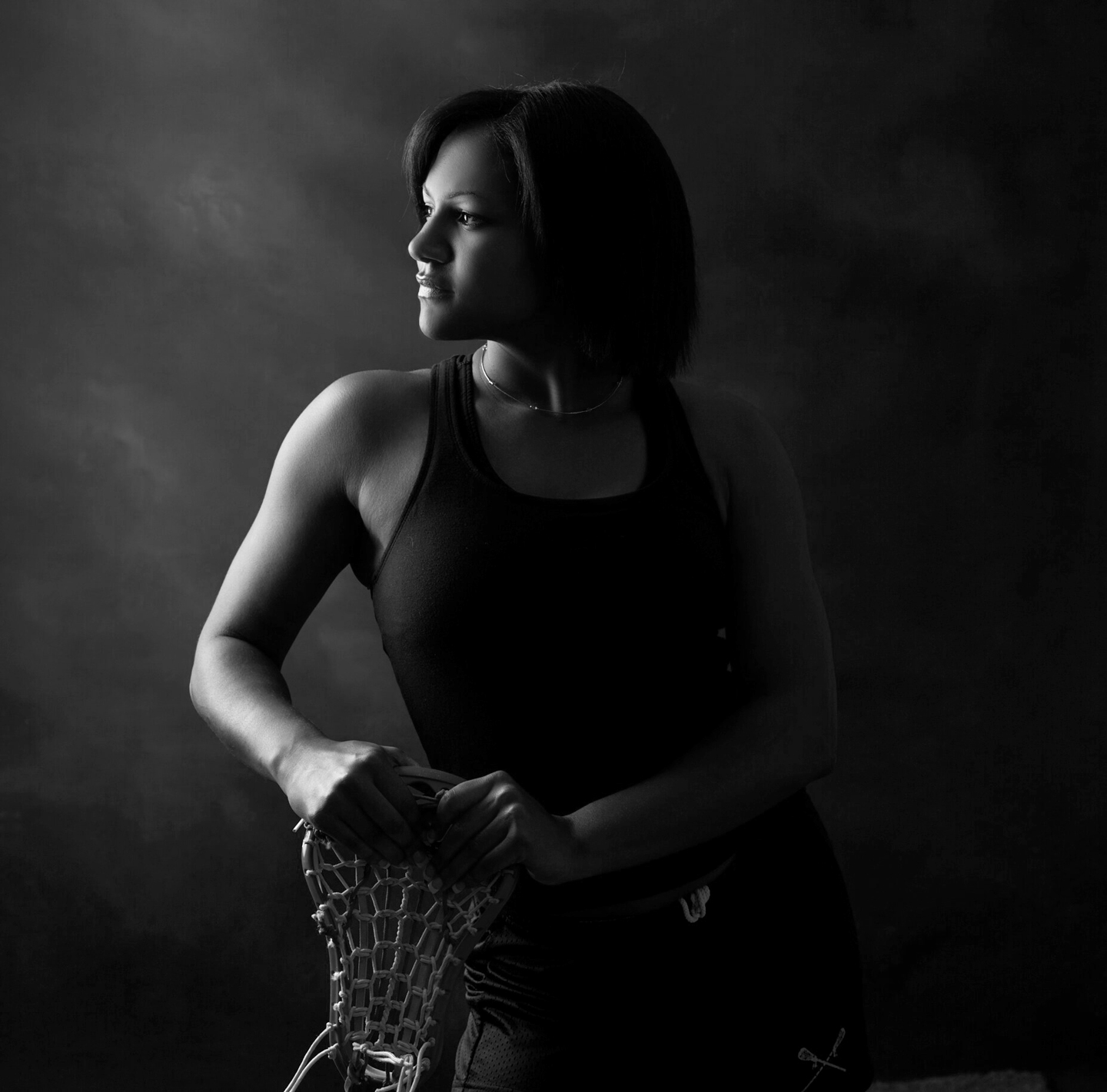 Senior portrait session black and white senior girl lacrosse stick