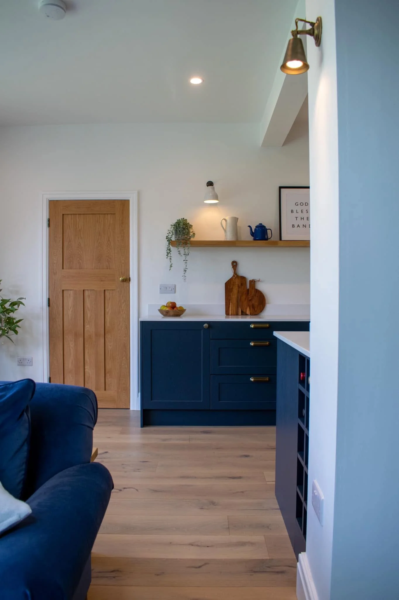 project-johnson-slate-blue-shaker-kitchen-view-from-living-room-oak-shelf-penwortham.jpg