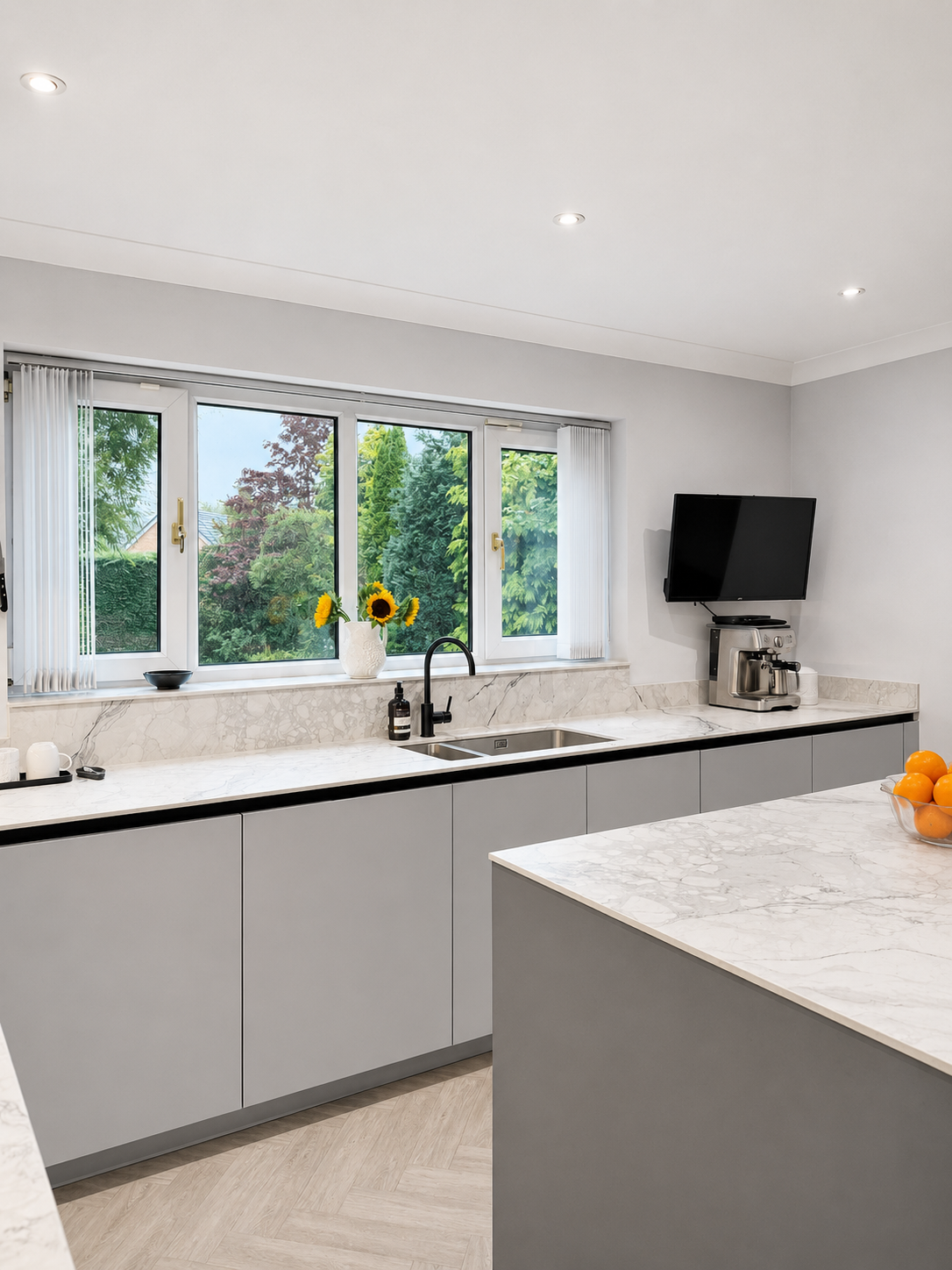 09-grey-handleless-run-marble-worktop-window-sink-stott.png