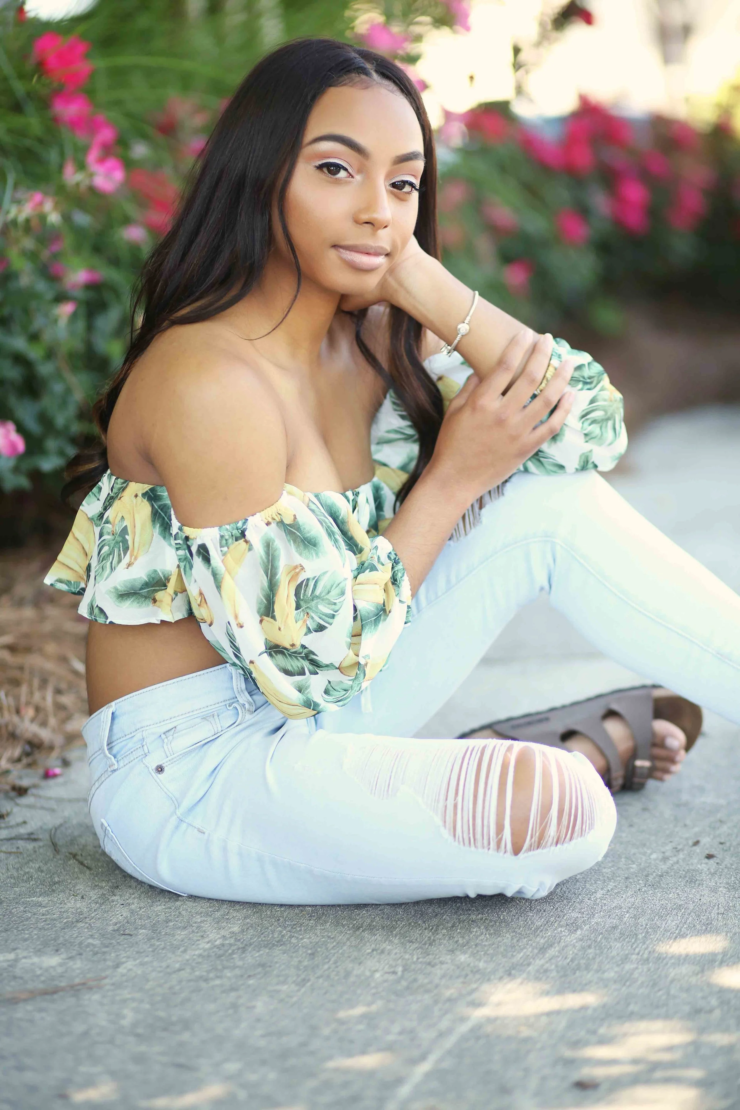 girl sitting with ripped jeans.jpg