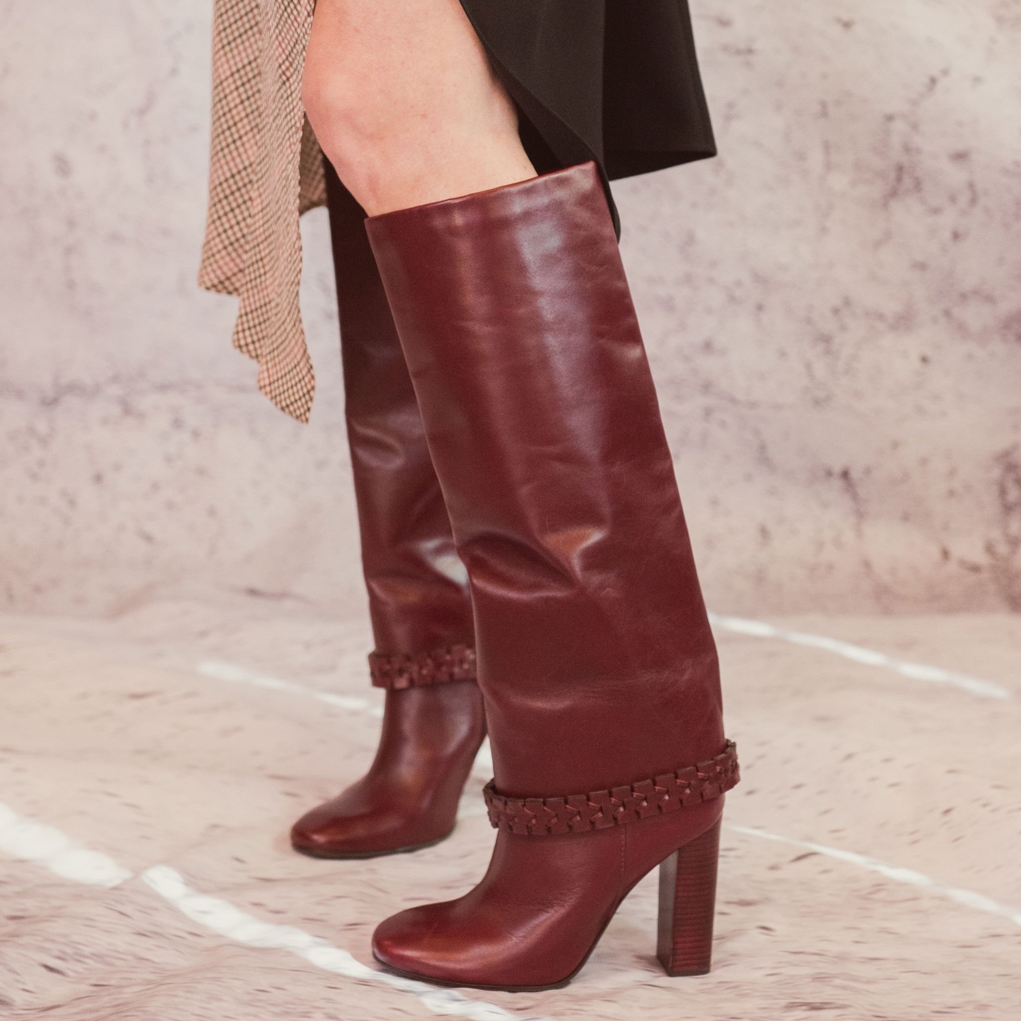 Tall maroon leather statement boots