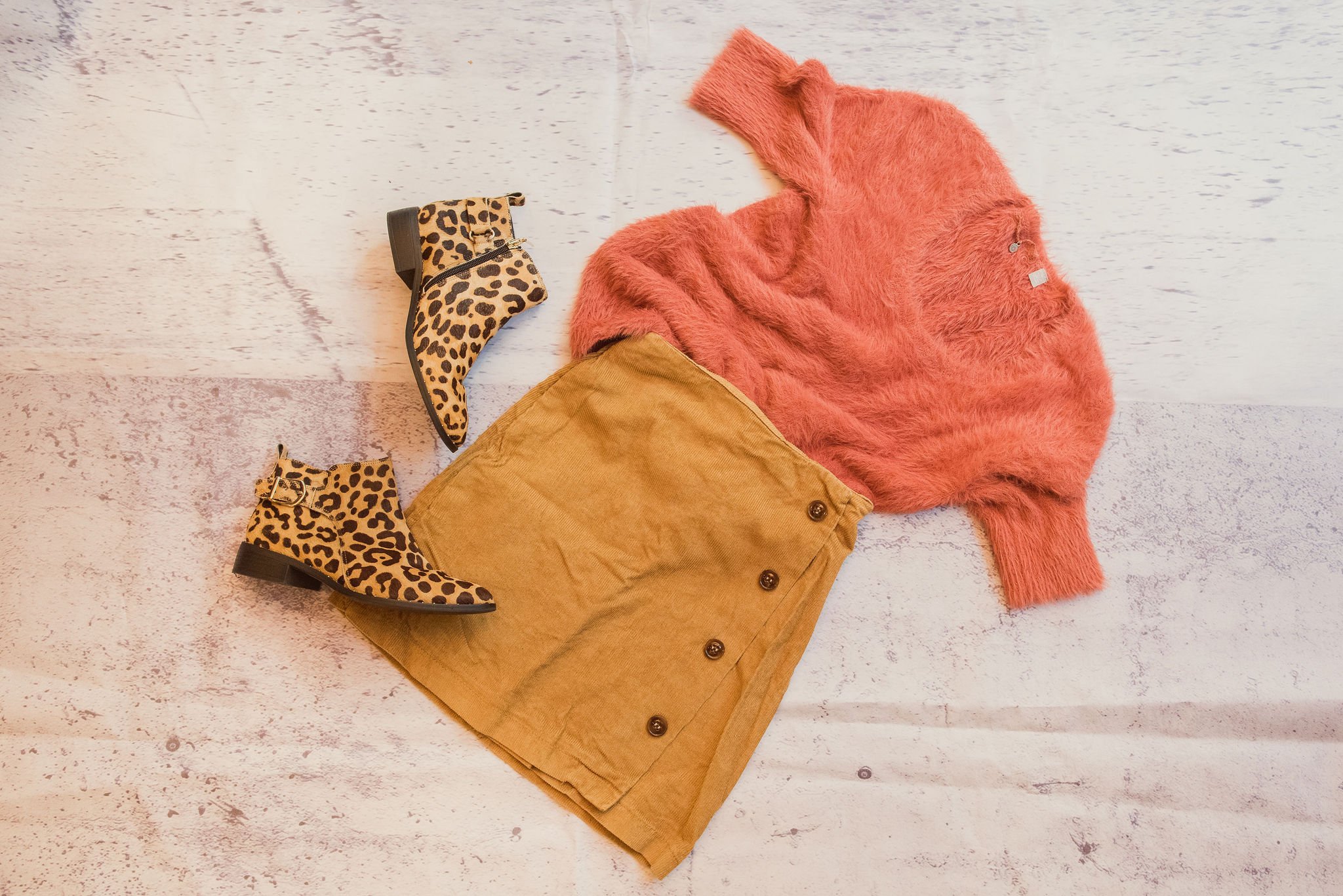 Cute Thanksgiving outfit of booties, skirt, and sweater