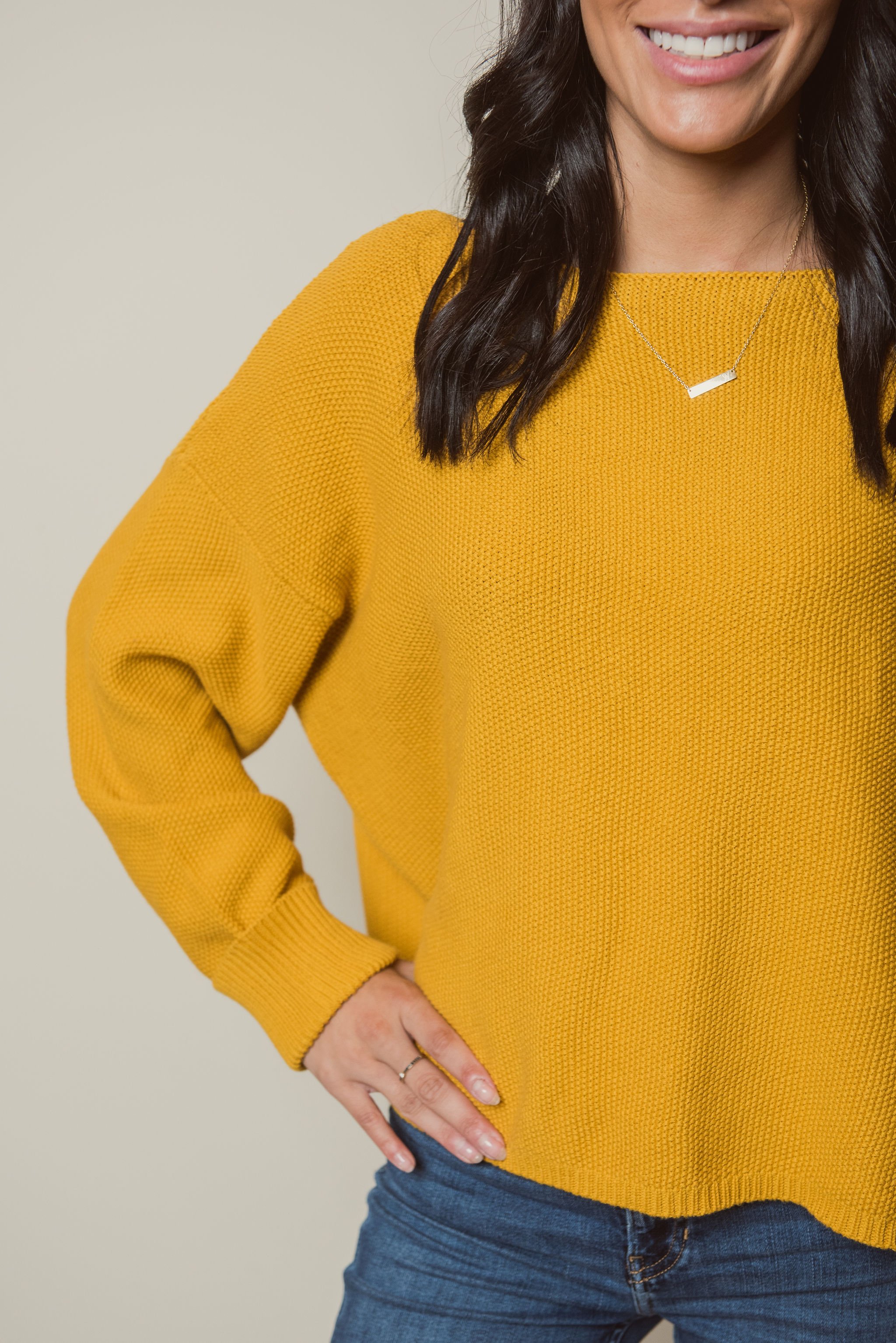 Unfoldid stylist in yellow sweater for Thanksgiving