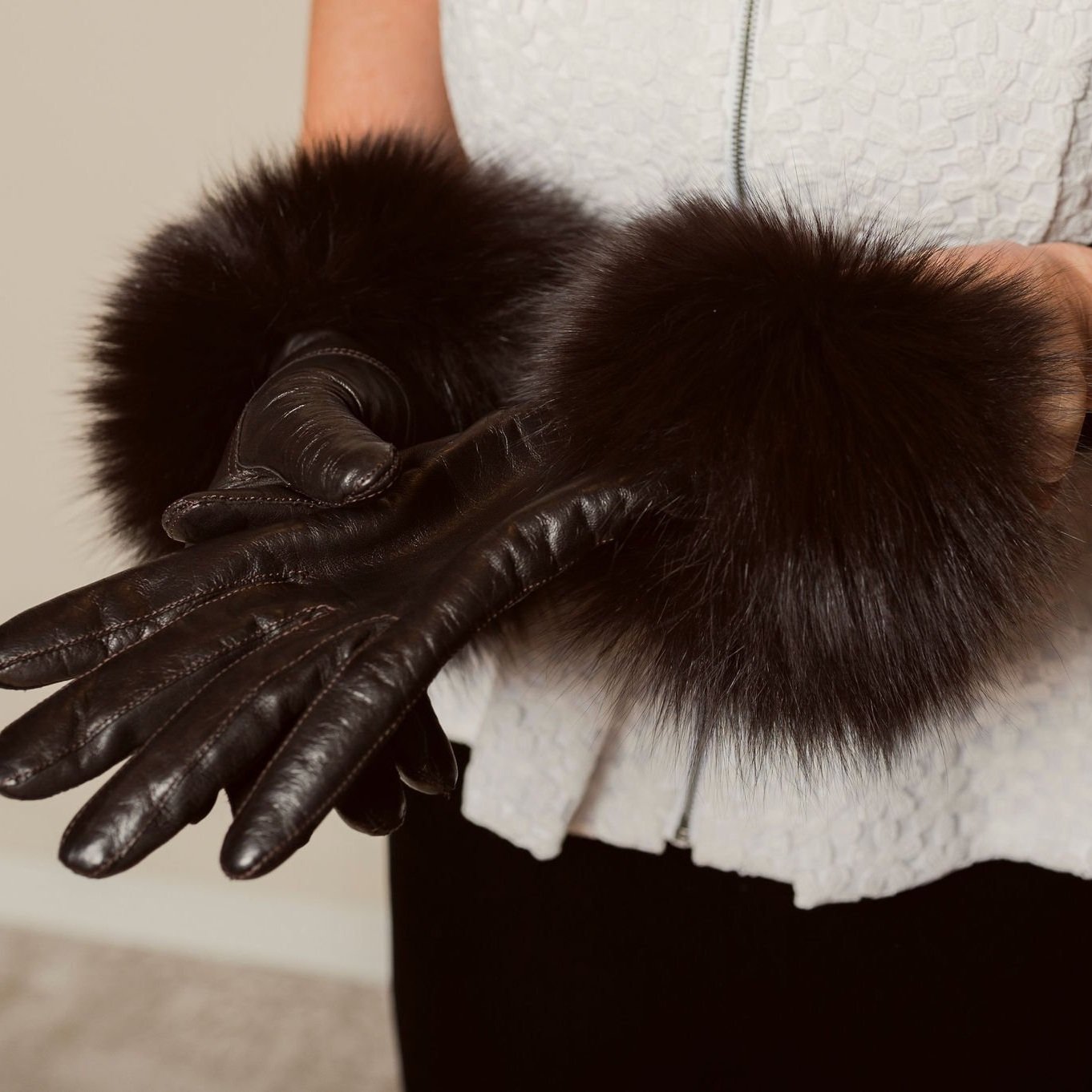 Black leather fur trimmed gloves.