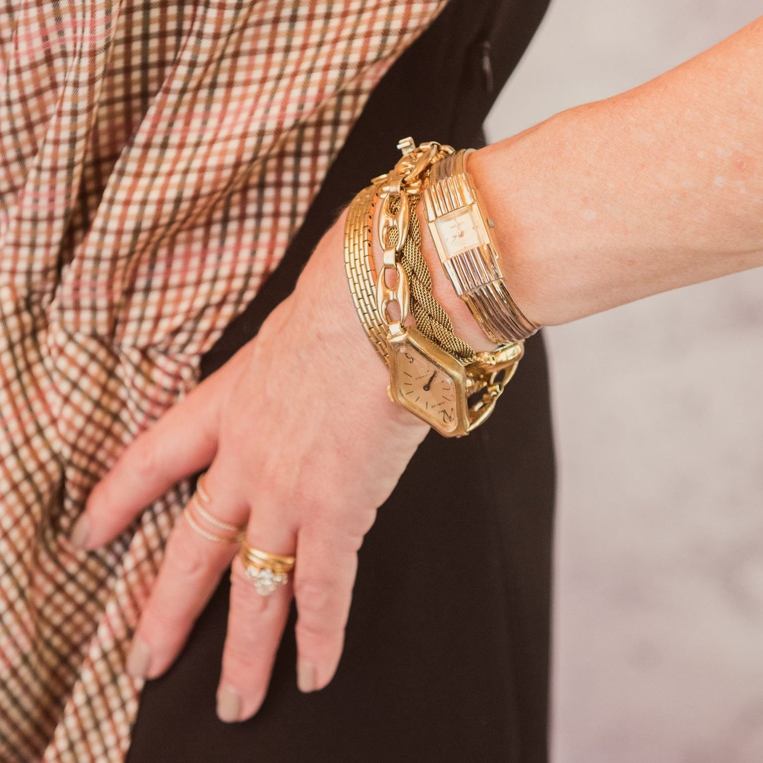 Gold watch and bracelets.