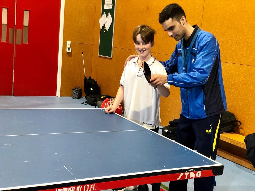 Dinyar Irani teaching an ACG Parnell student how to correctly play a forehand shot in Table Tennis