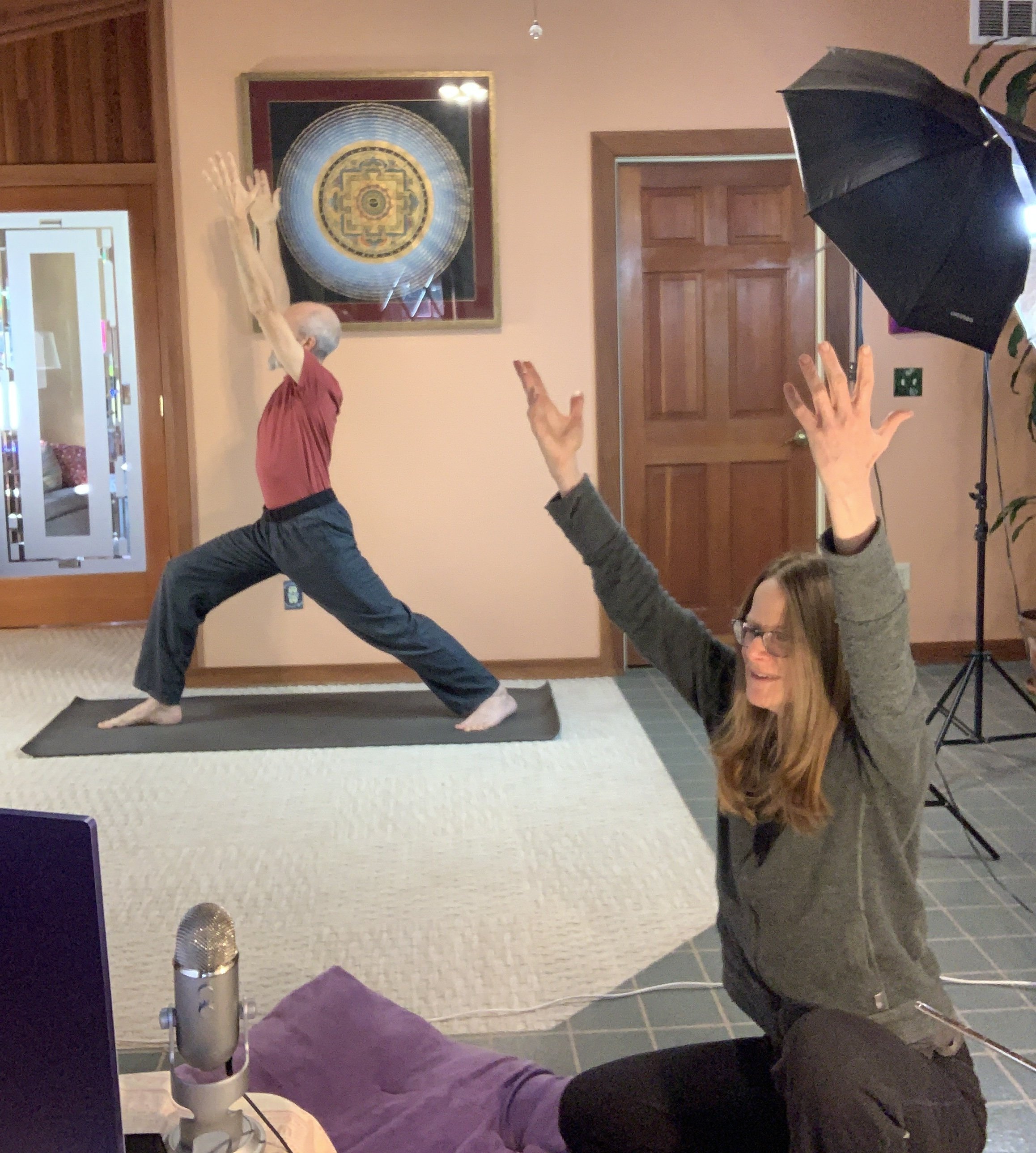 Man and Woman doing yoga on Zoom