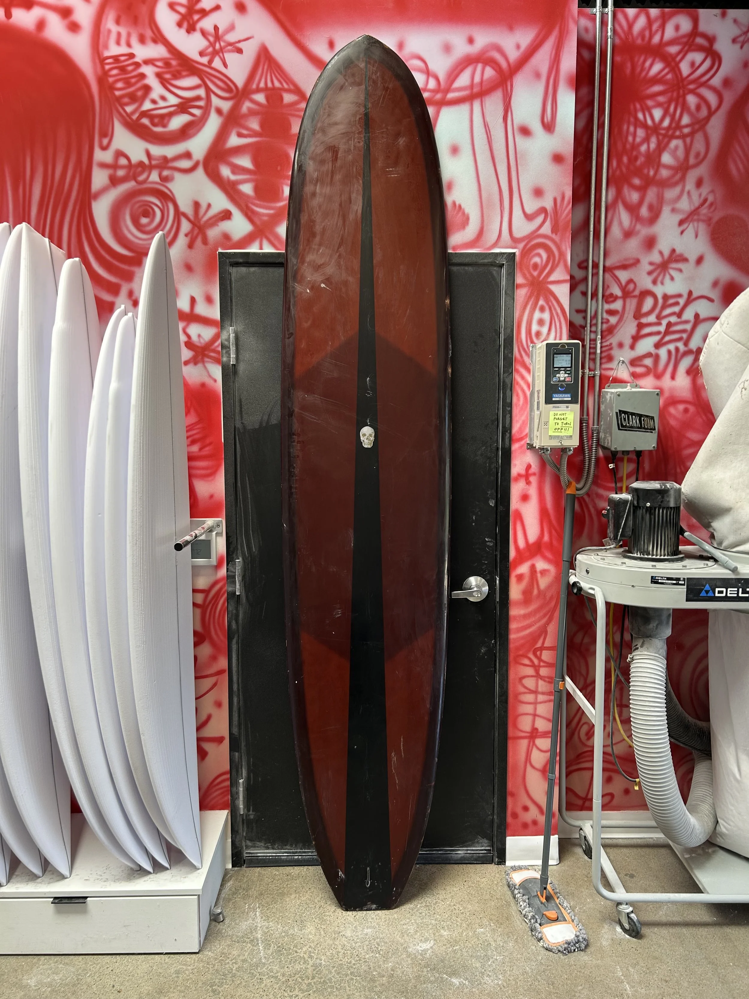 brown used longboard