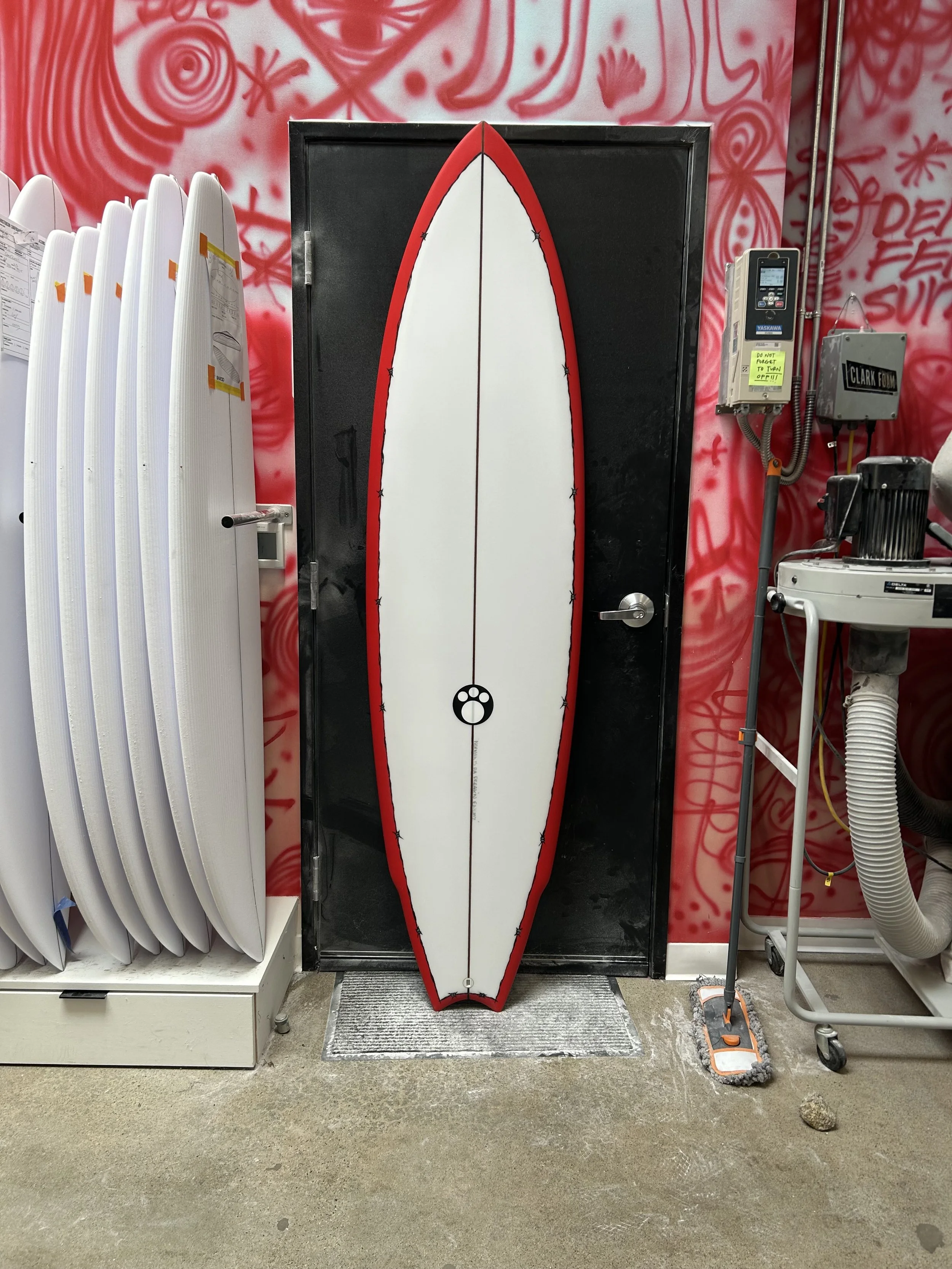 red rail VeeCon III against shop door top