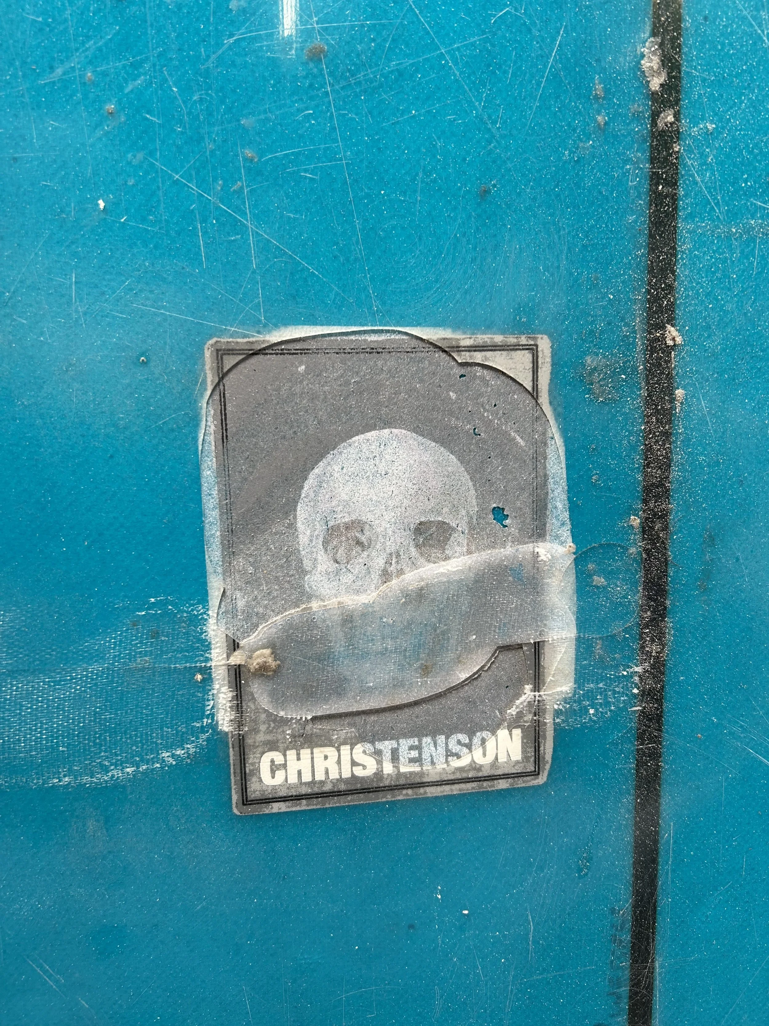 delamination on logo of blue surfboard