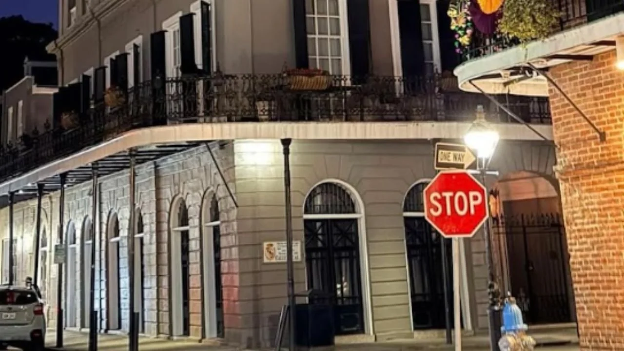 Ghostly orb glowing in the night sky above a historic building in New Orleans.