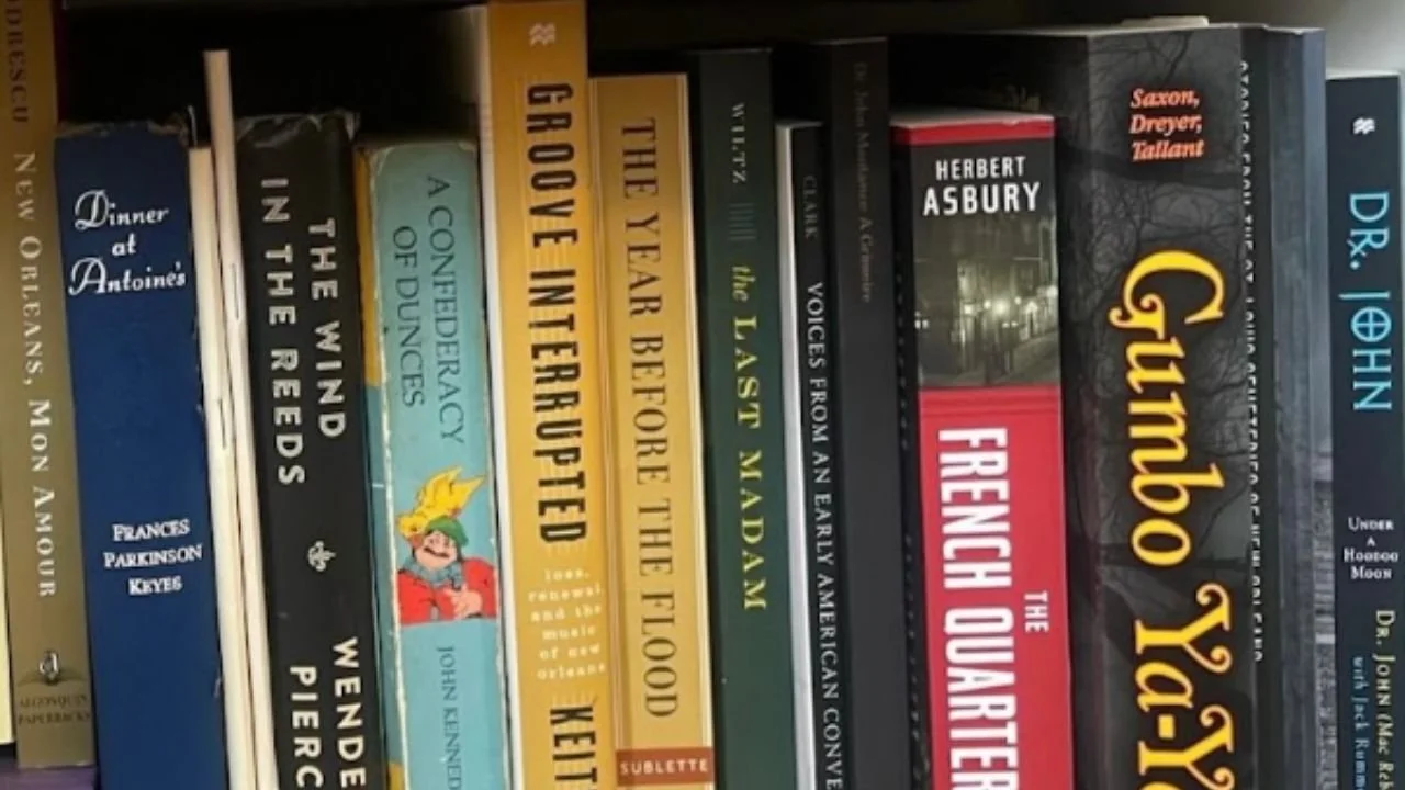 A shelf of books about New Orleans including The Last Madam, a true story about Norma Wallace.