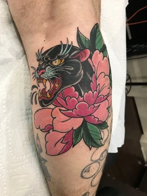 flower and panther tattoo.jpg
