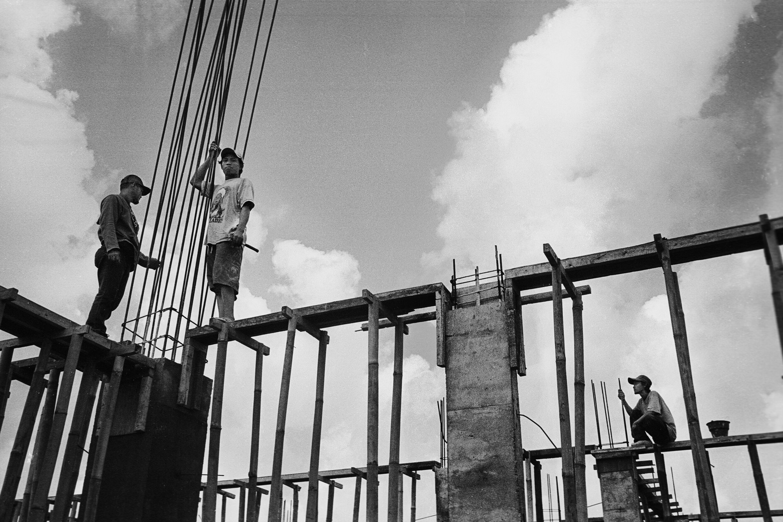  Seminyak, Indonesia  Labourer resting on structural work. 