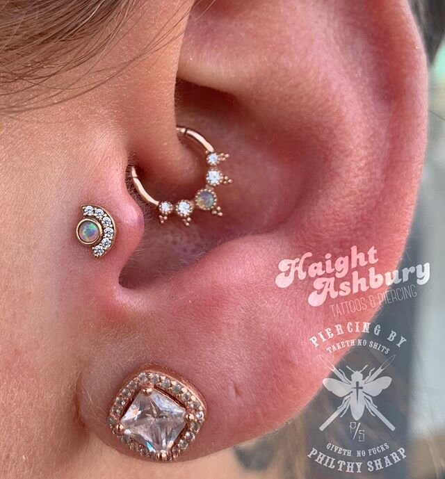 This combo has us drooling! 🤤 A daith upgrade &amp; fresh tragus adorned with beautiful genuine opal pieces from @buddhajewelryorganics. Swipe to see the close up of that one of a kind Simone clicker 👀❤️ Courtesy of @philthysharp