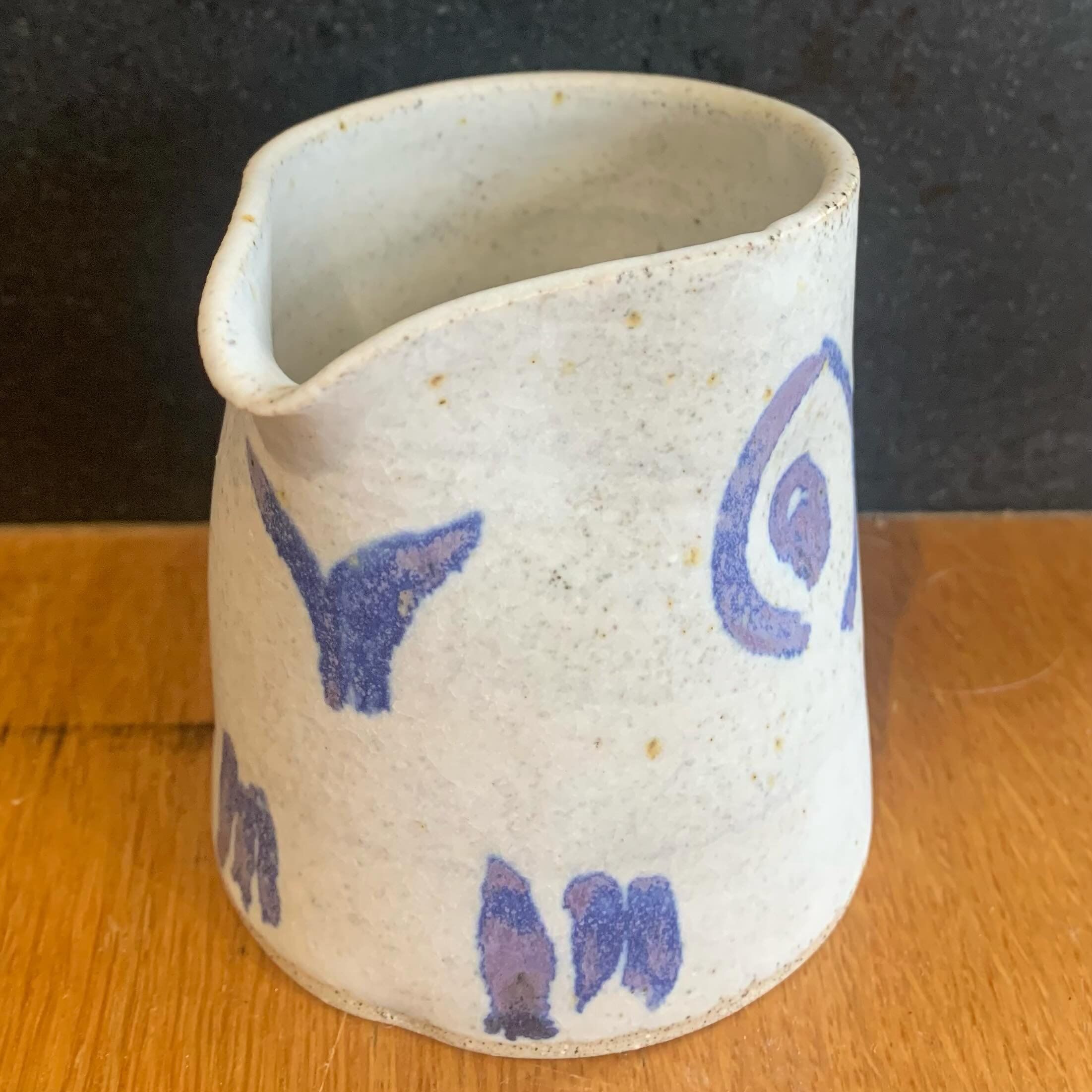 A small thrown and altered jug using recycled clay and a dolomite glaze decorated with cobalt carbonate brushstrokes. It was the last piece decorated after a long day of glazing. I was tired and just let it happen without any great thought. What I fi