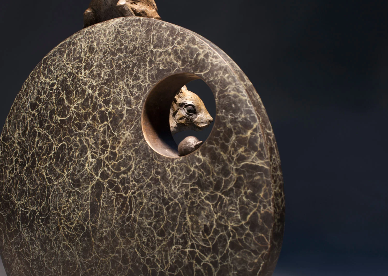 gillick-red-squirrel-and-the-hazel-nut-bronze-sculpture-on-disc-backside-peep-hole-web.jpg
