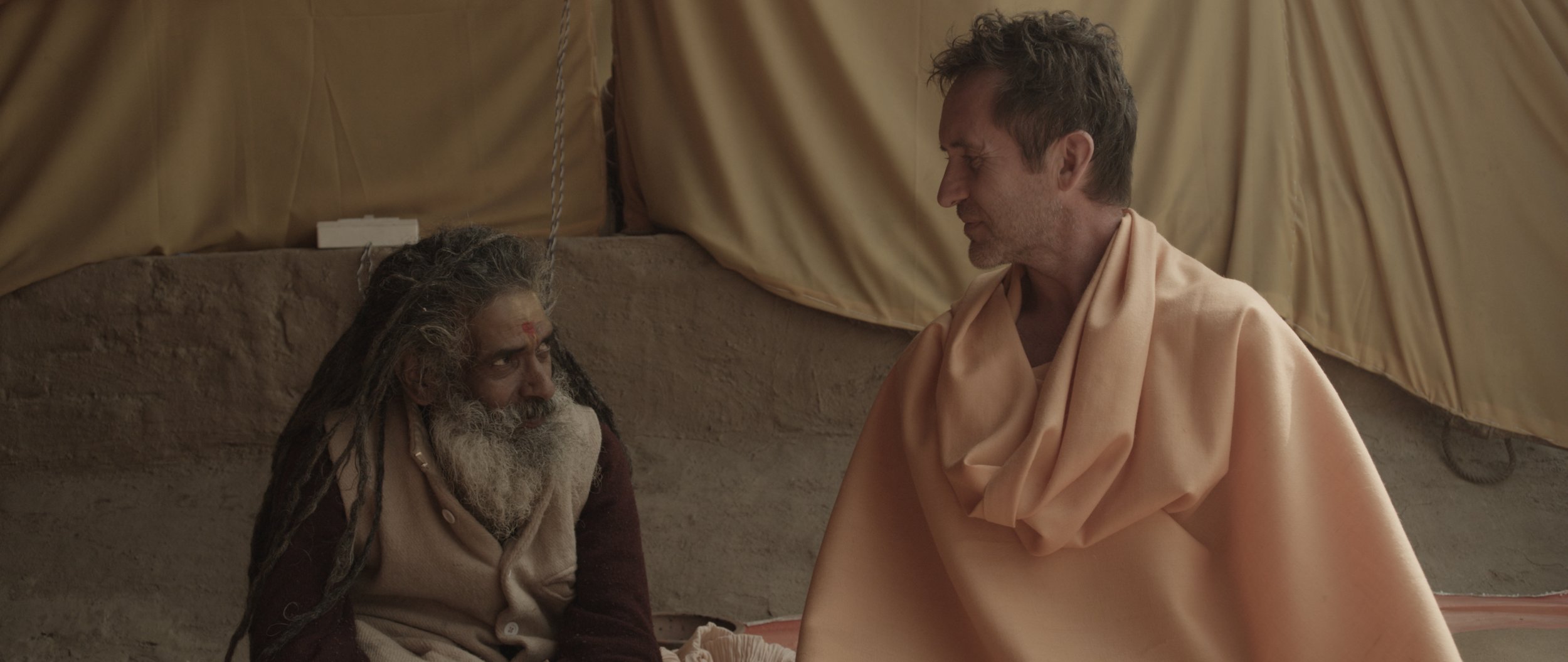 Bruce with RamananGiri at the Kumbh Mela Festival in the making of Tawai