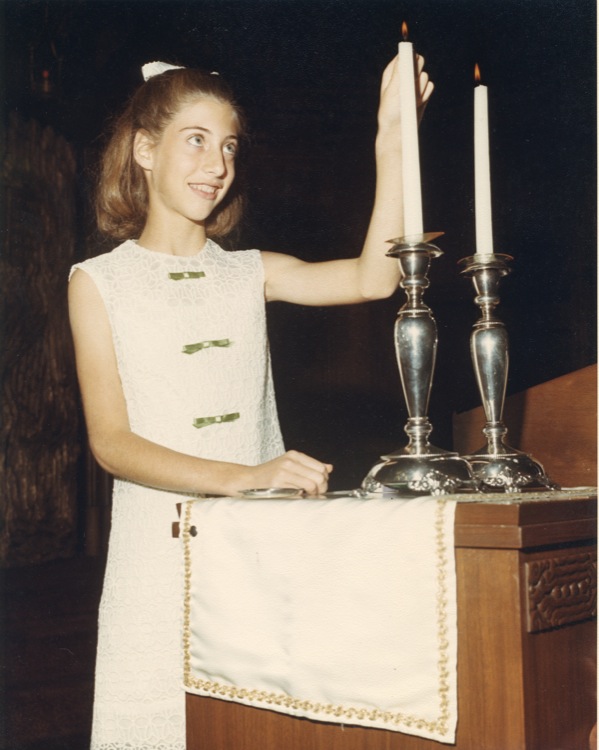 Laurie Levine lighting Shabbat Candles at her Bat Mitzvah