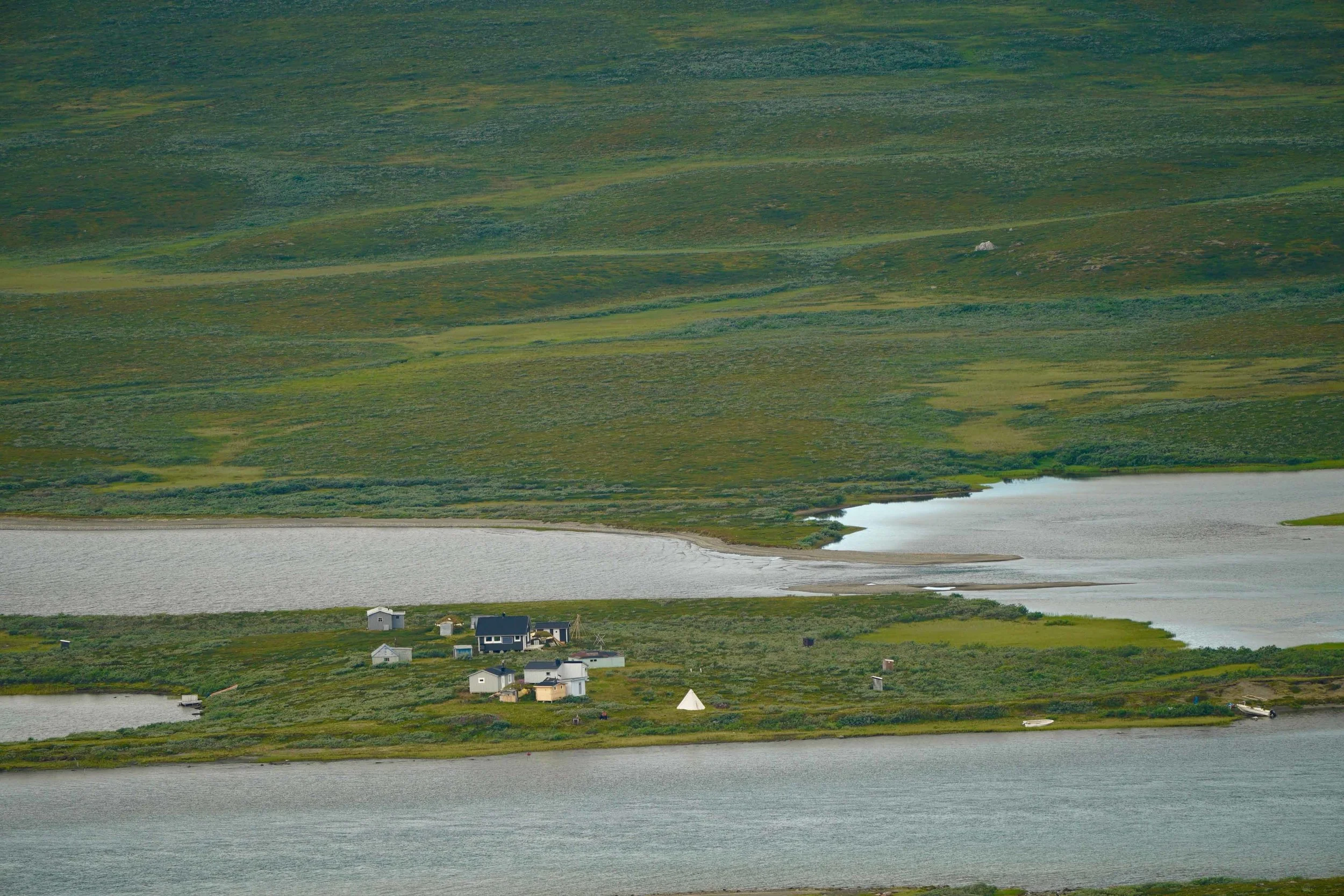 A remote Sámi village.The Sámi people are a Finno-Ugric people inhabiting Sápmi, which today encompasses large northern parts of Norway and Sweden, northern parts of Finland, and the Murmansk Oblast of Russia. The Sámi have historically been known in English as Lapps.