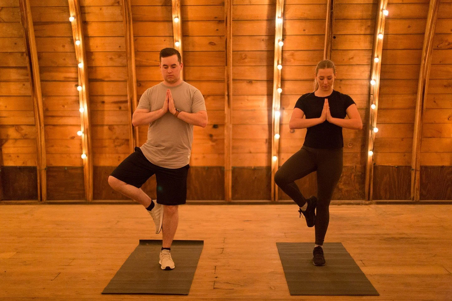 Imagine the soft glow of twinkle lights spilling over the aged wood of a beautifully restored Hayloft. This isn't just a yoga class; it's an escape to a place of pure tranquility.

An evening yoga class in our Hayloft with wine and a tour of the Ranc