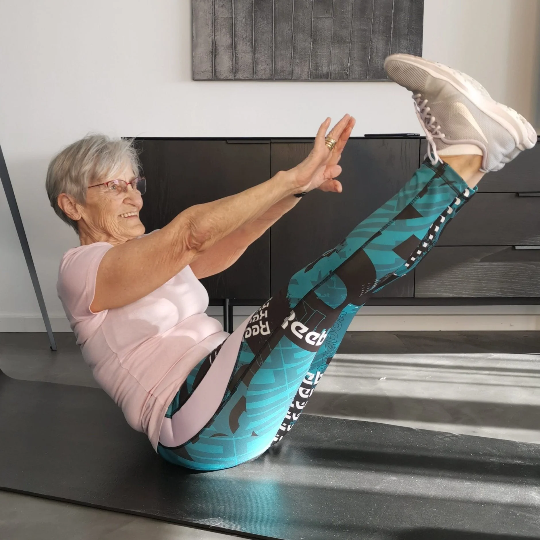 Watch This 82 Year Old Woman Do A One-Armed Plank While You House More Chips On Your Couch